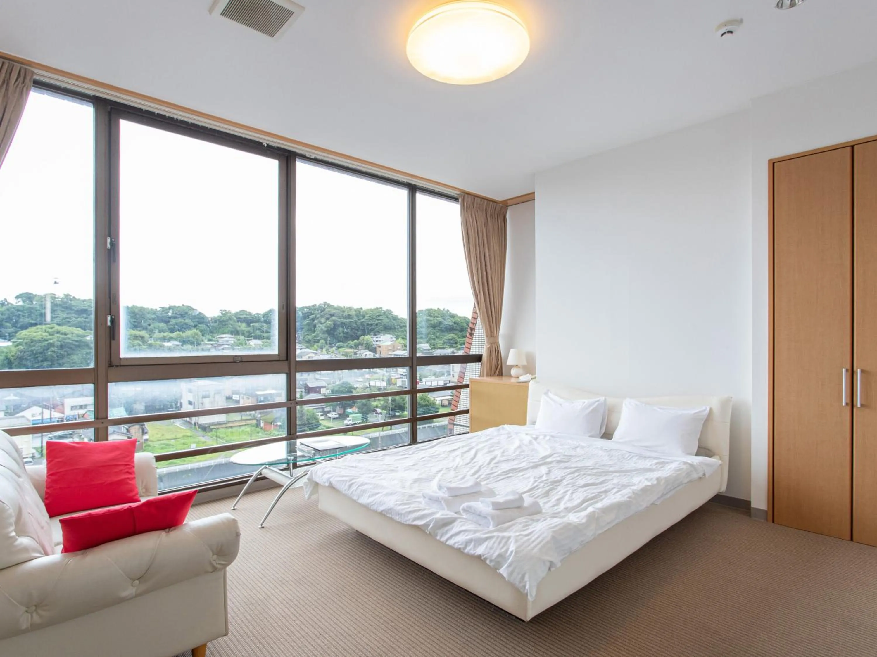 Photo of the whole room, Bed in Tabist New World Hotel Kagoshima Kanoya