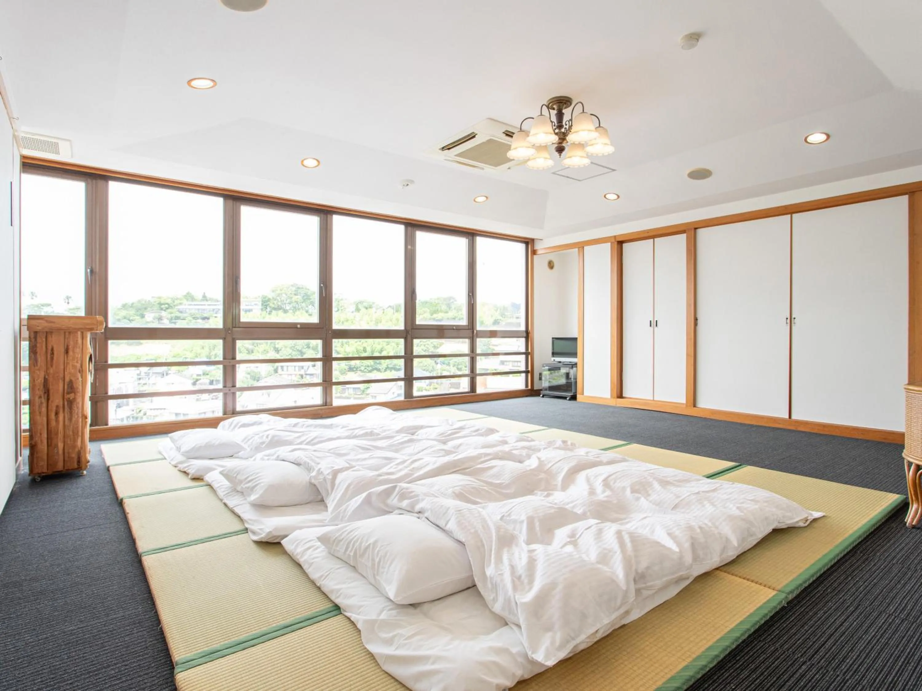 Photo of the whole room, Bed in Tabist New World Hotel Kagoshima Kanoya