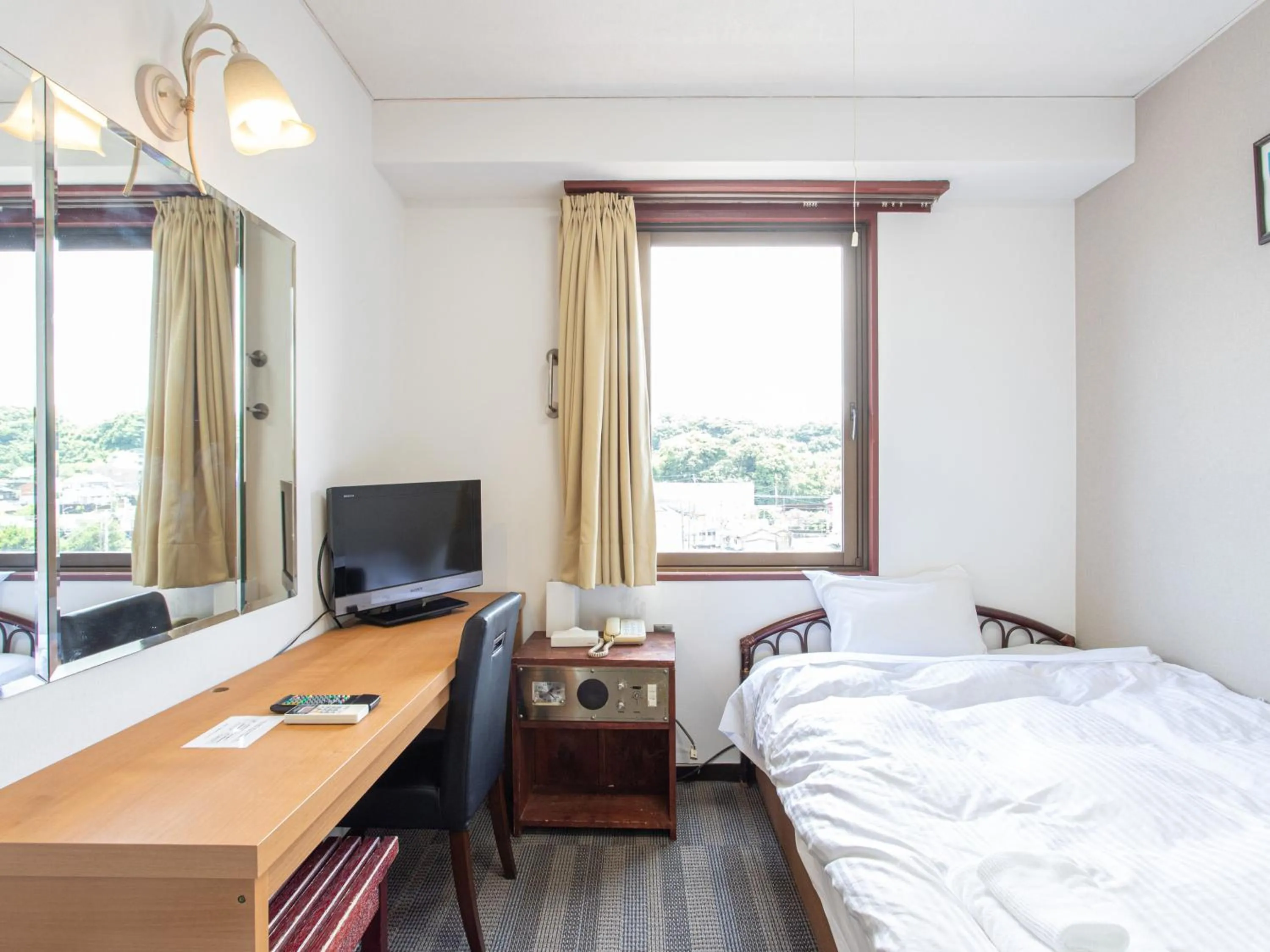 Photo of the whole room, Bed in Tabist New World Hotel Kagoshima Kanoya
