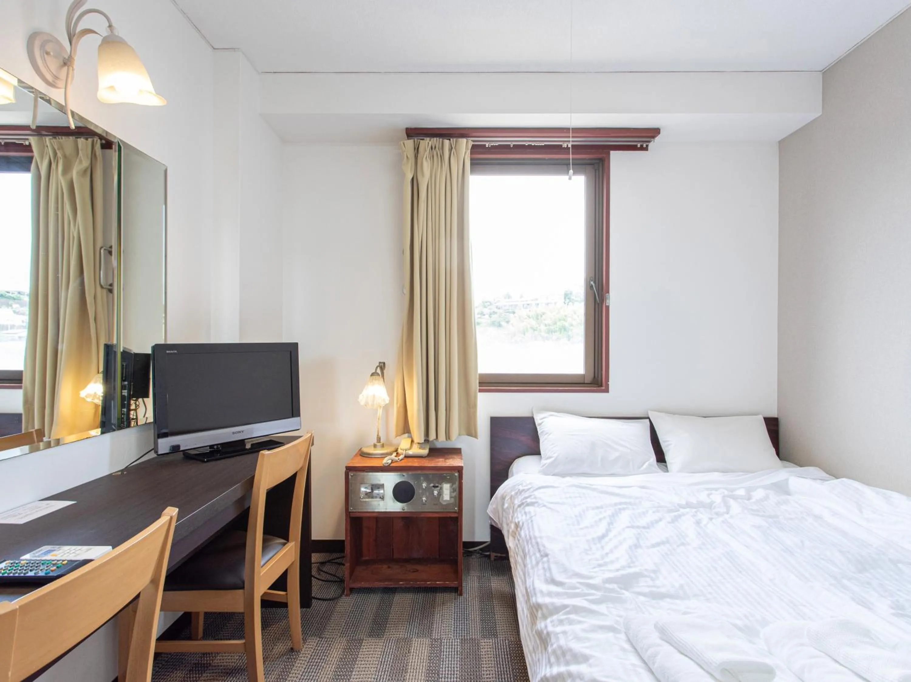 Photo of the whole room, Bed in Tabist New World Hotel Kagoshima Kanoya