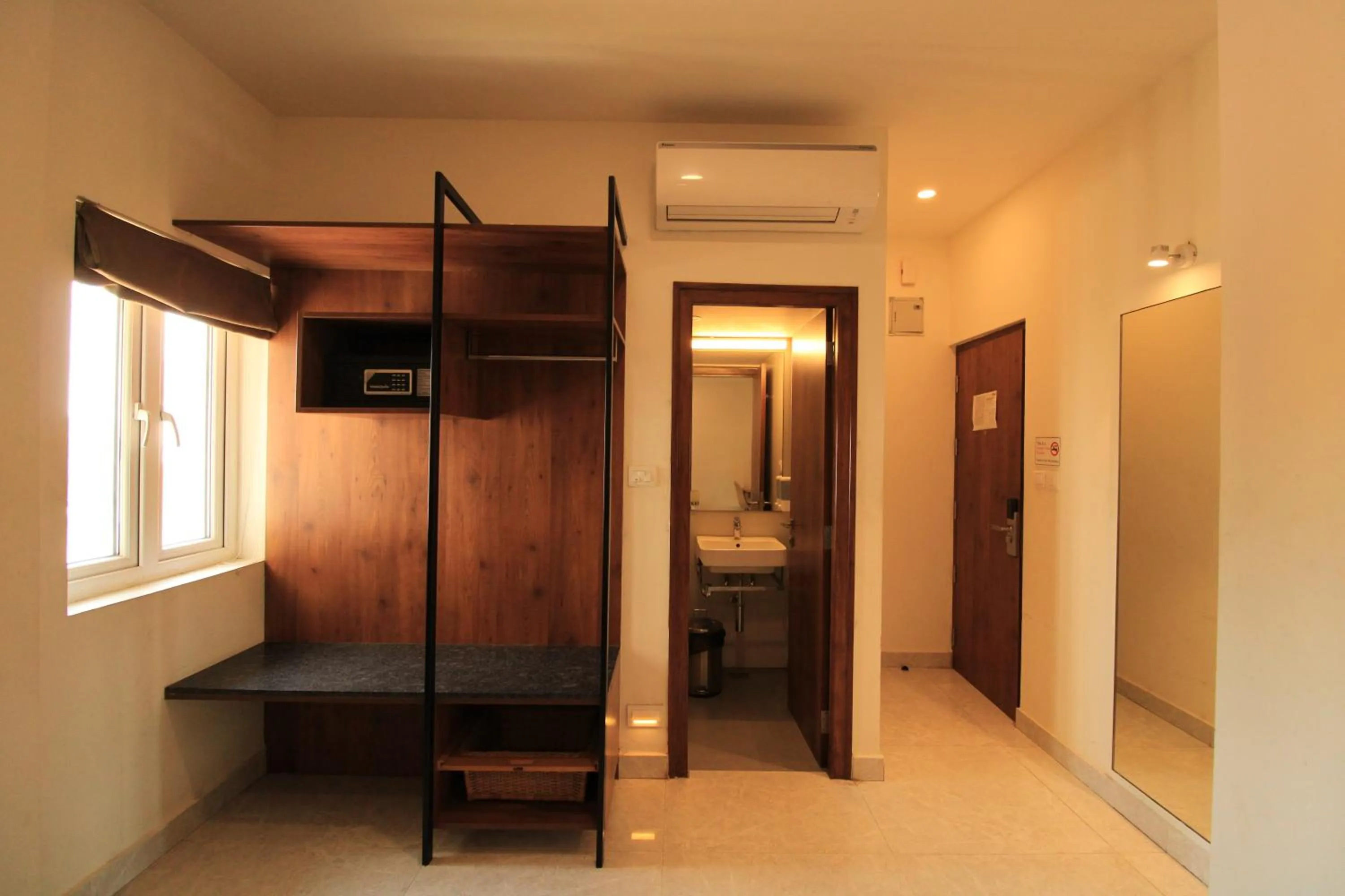 Communal lounge/ TV room, Bed in Arunaa Inn Airport Hotel,Chennai