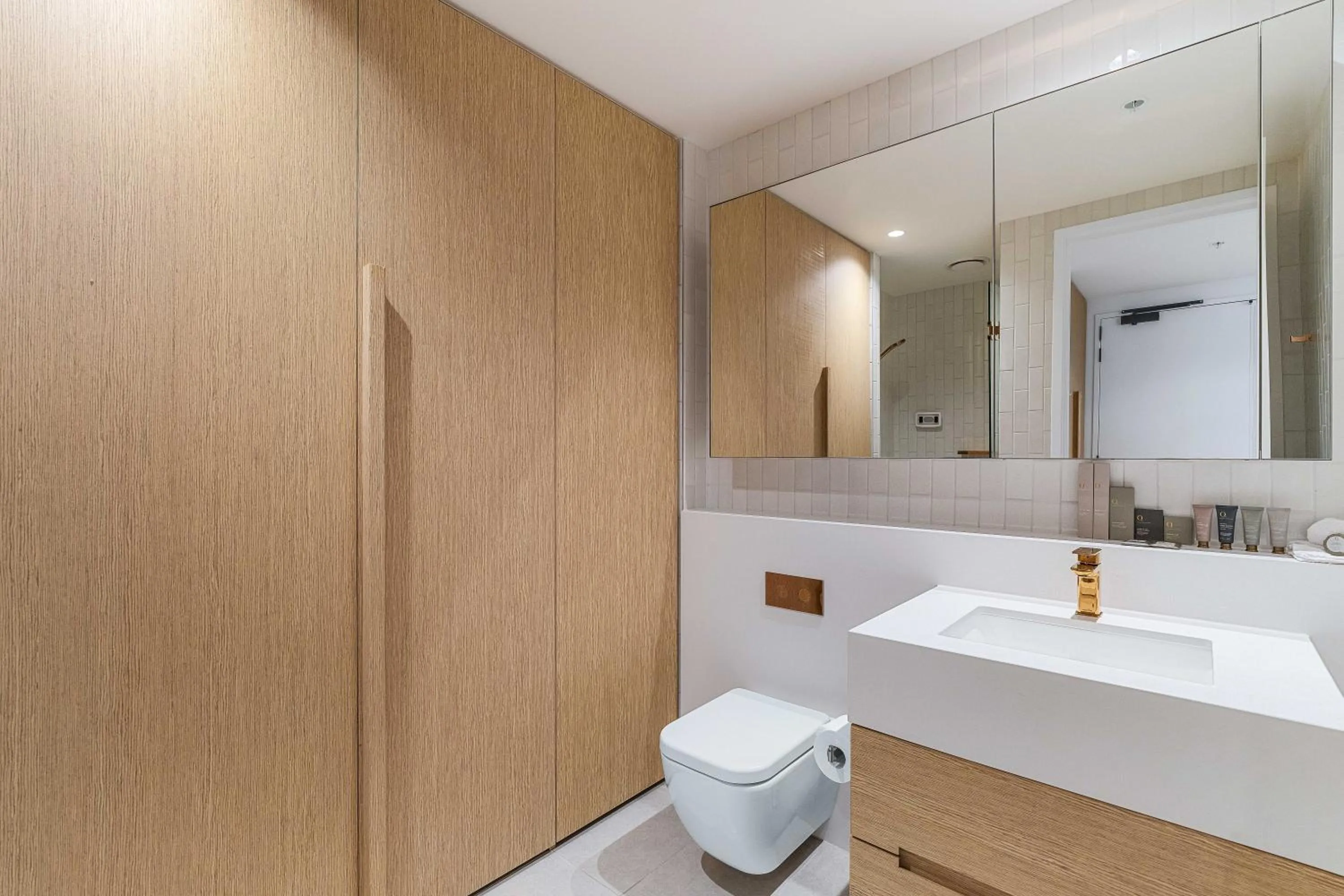 Toilet in Collins House Apartments by CLLIX