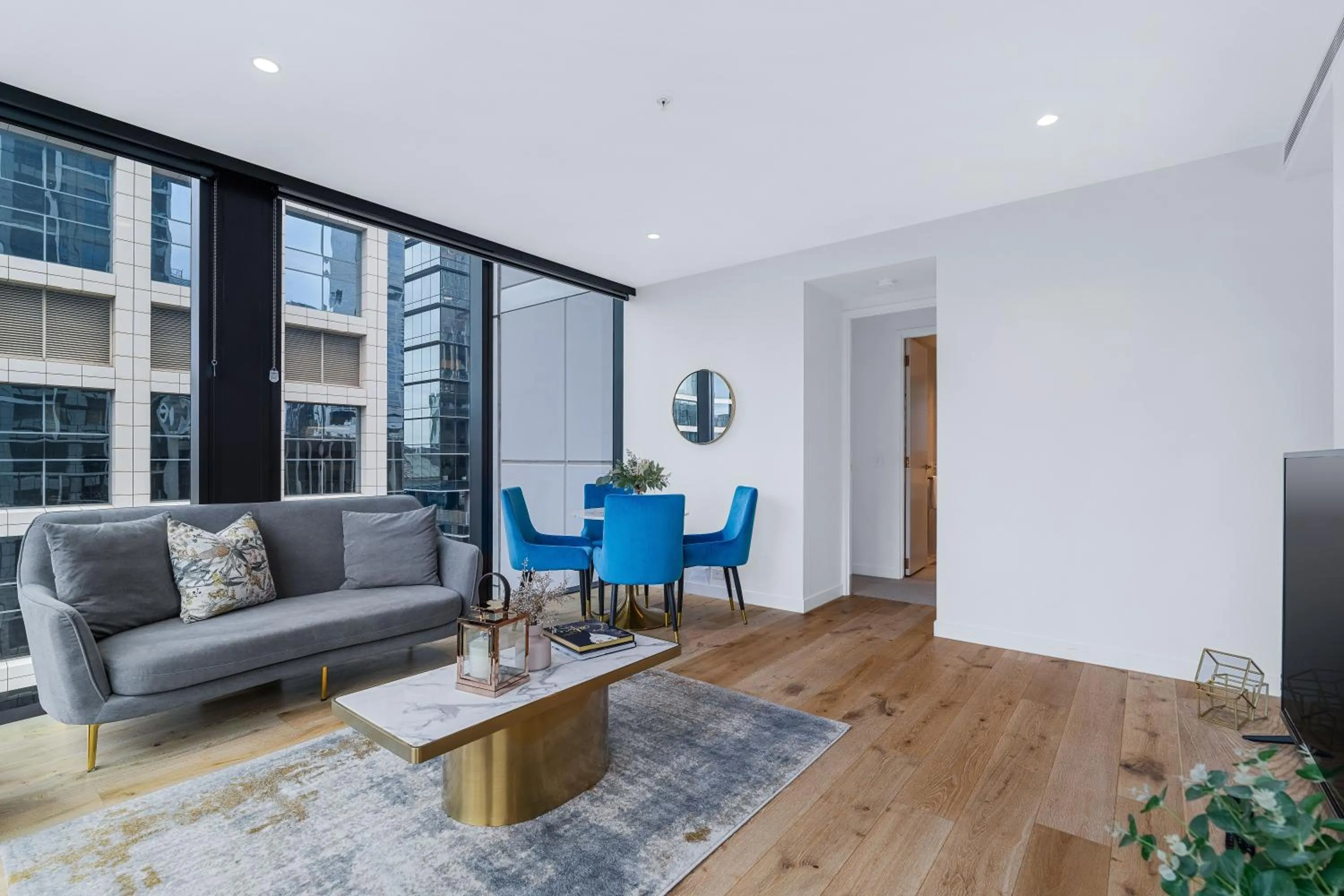 Living room in Collins House Apartments by CLLIX