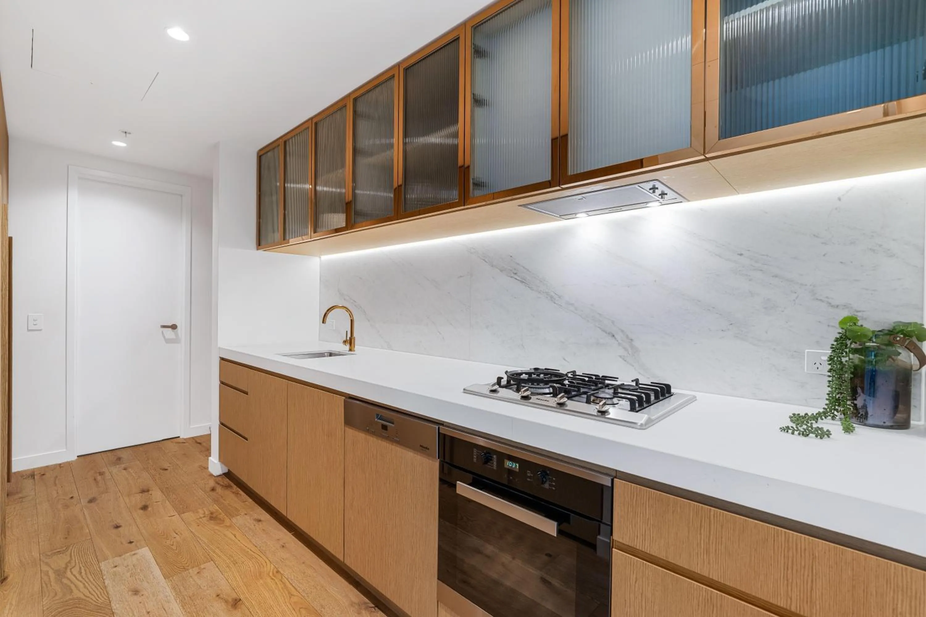 Kitchen or kitchenette in Collins House Apartments by CLLIX