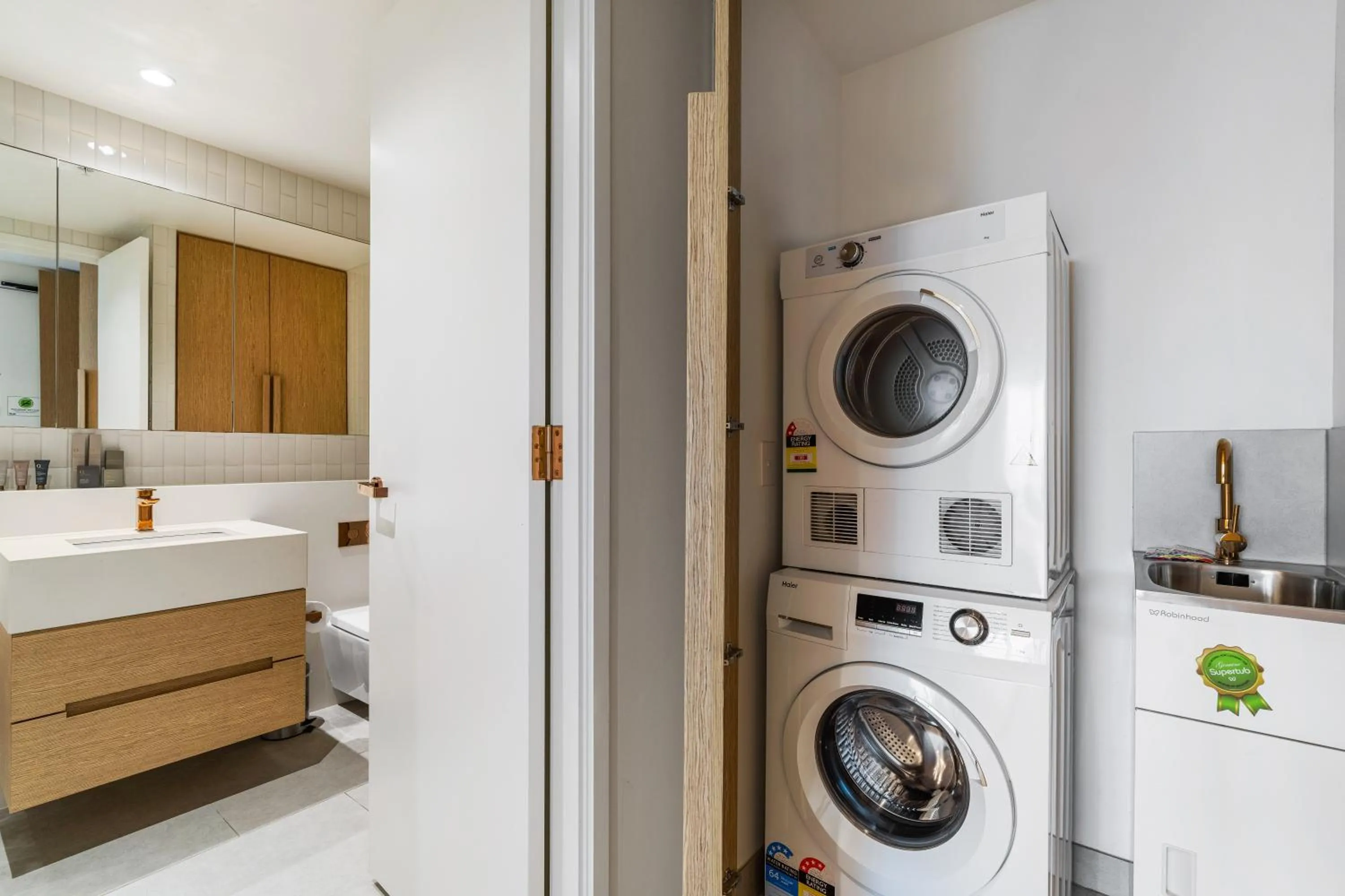 washing machine in Collins House Apartments by CLLIX