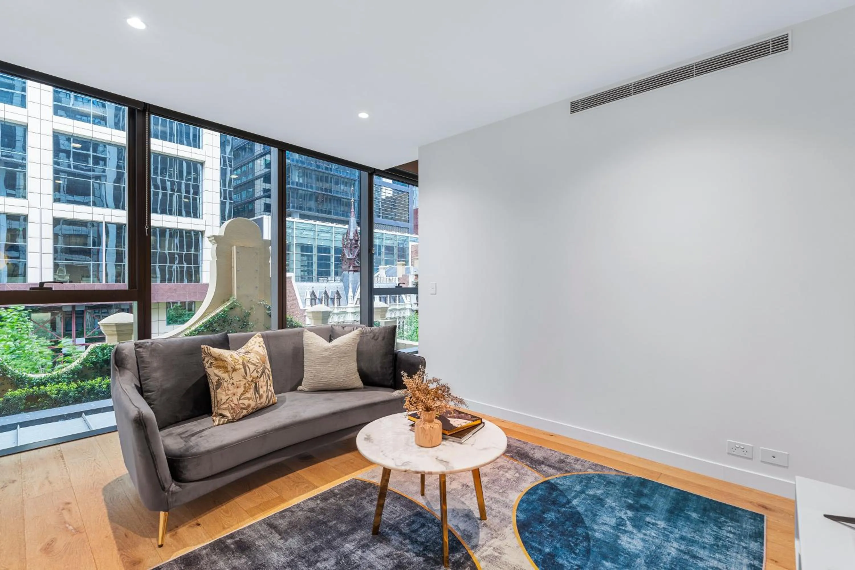 Living room in Collins House Apartments by CLLIX