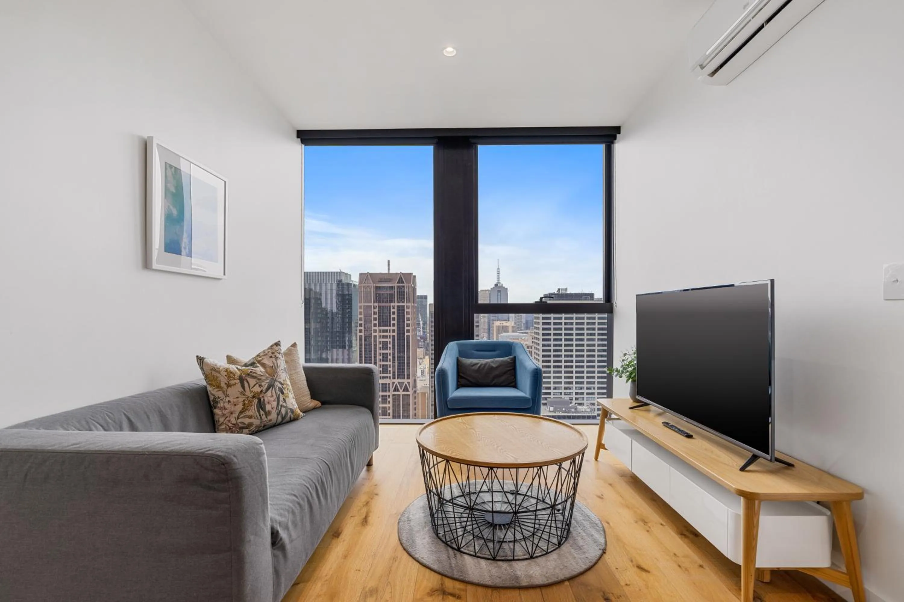 Living room in Collins House Apartments by CLLIX