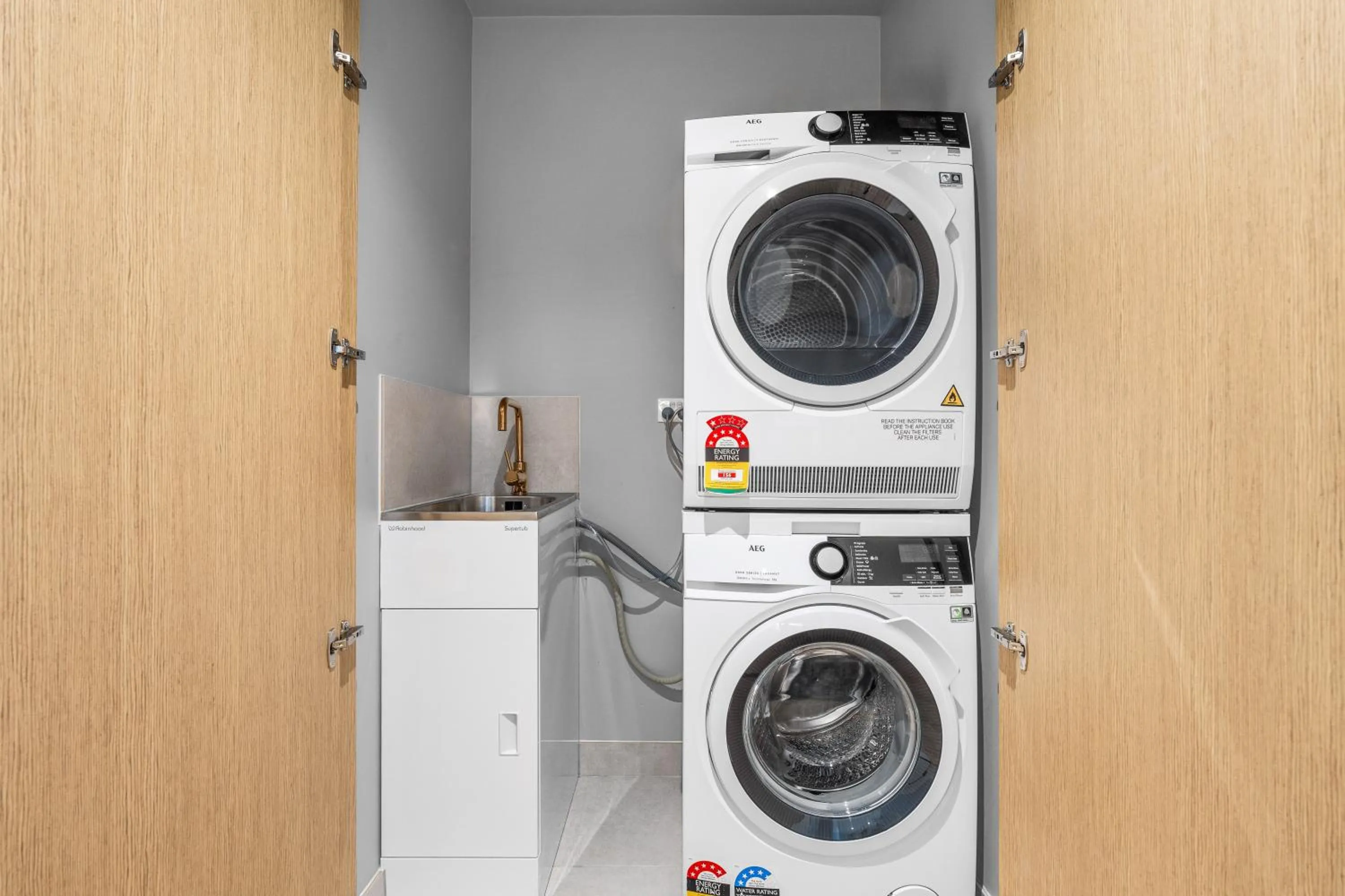 laundry in Collins House Apartments by CLLIX