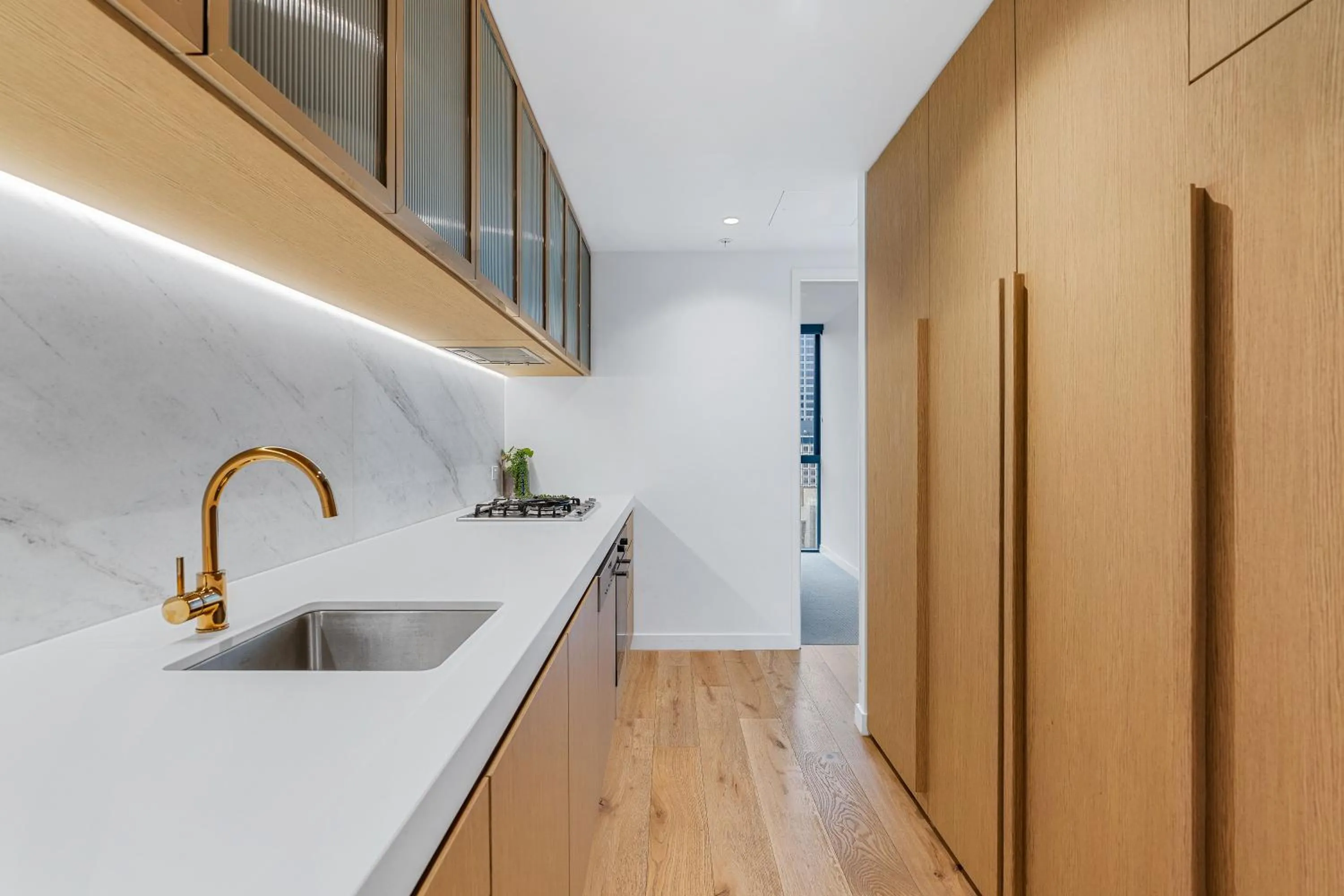 Kitchen or kitchenette in Collins House Apartments by CLLIX