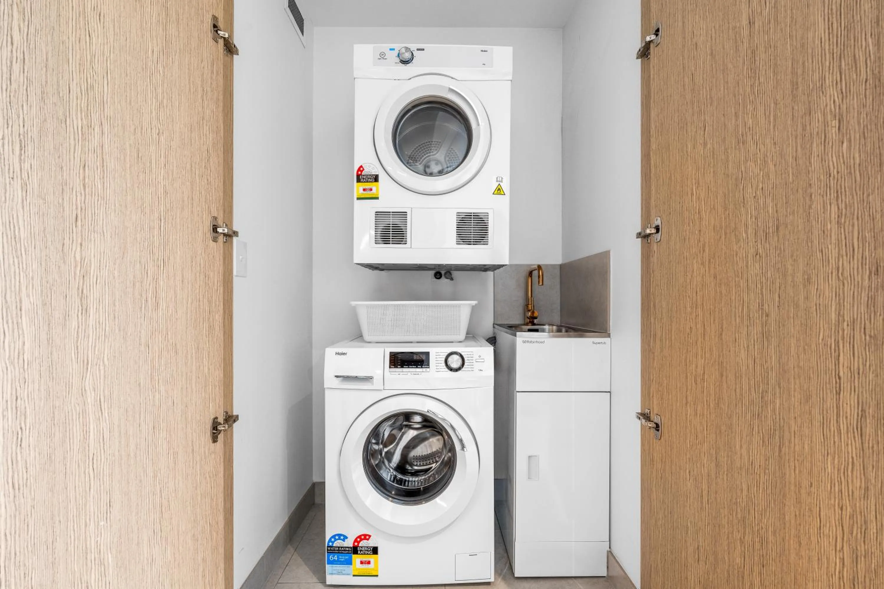 laundry in Collins House Apartments by CLLIX