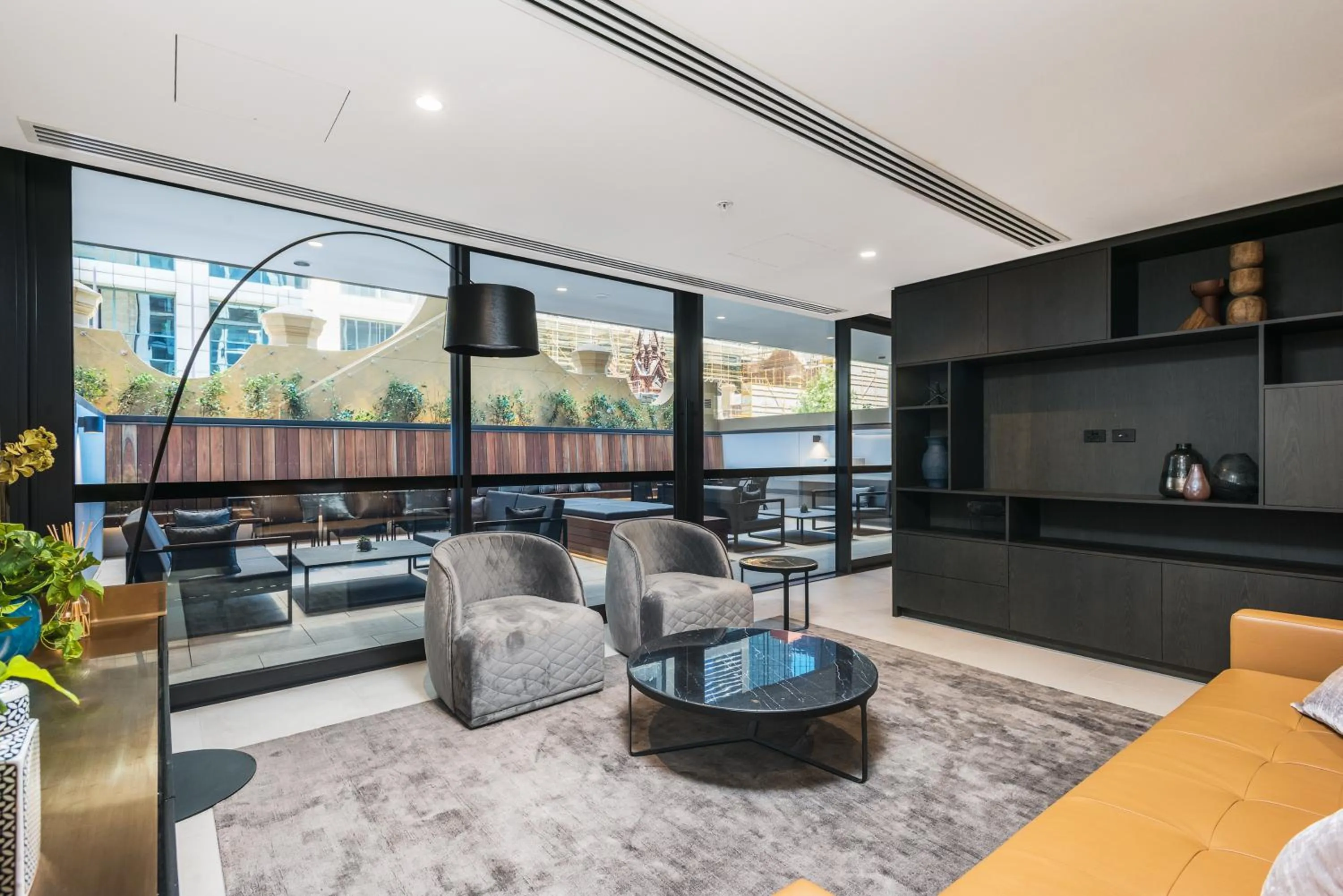 Communal lounge/ TV room in Collins House Apartments by CLLIX