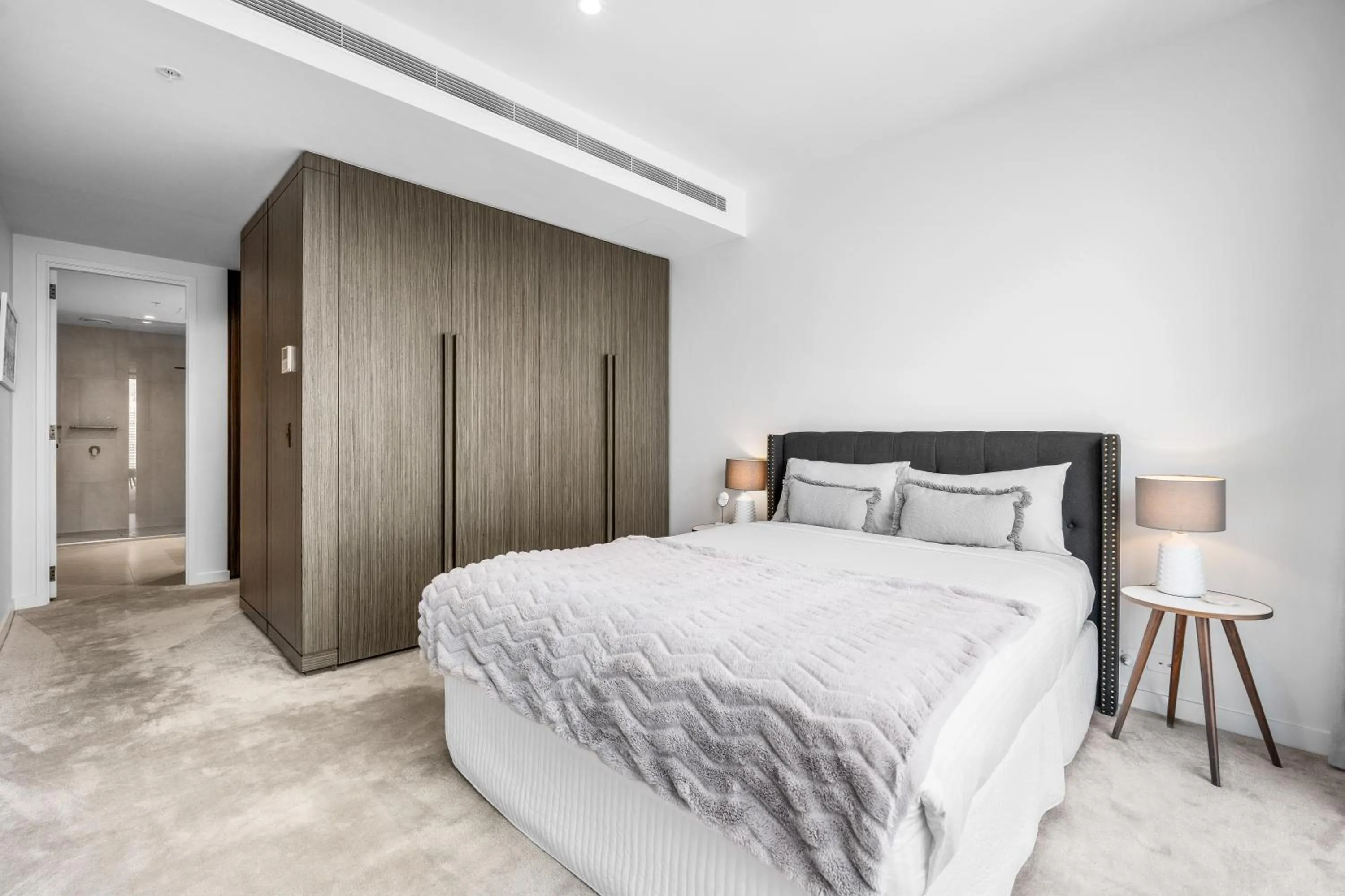 Bed in Collins House Apartments by CLLIX