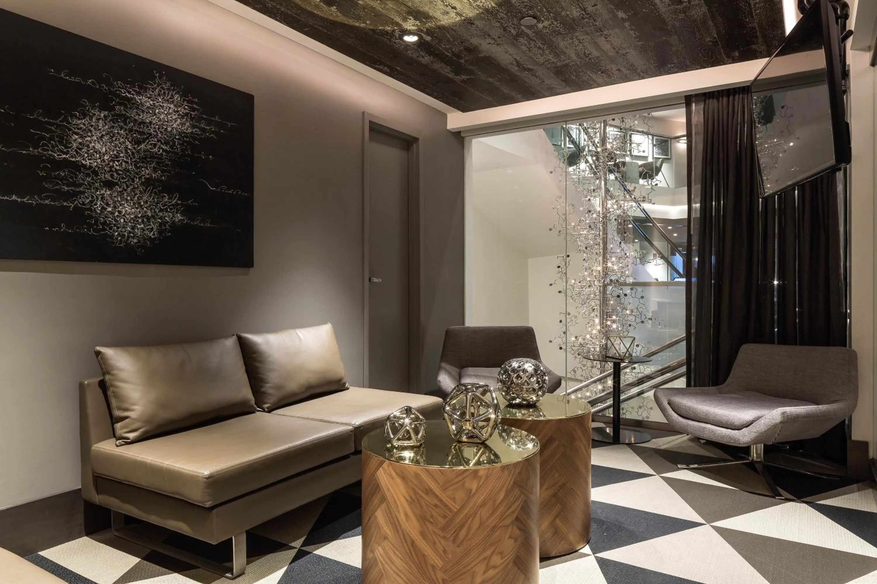 Communal lounge/ TV room in The Windsor Suites