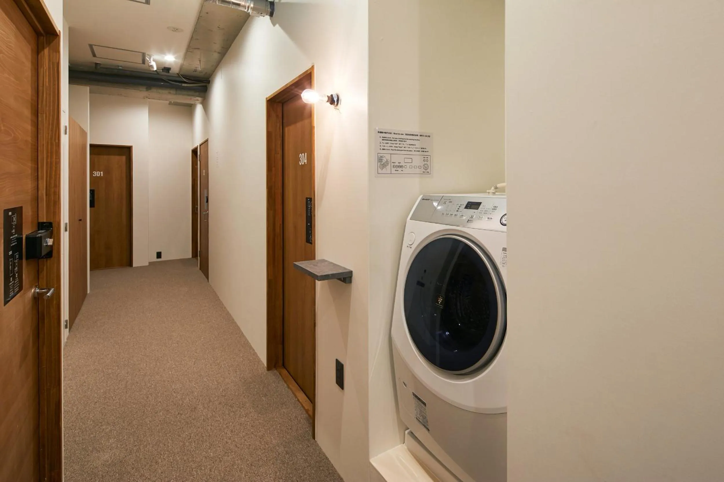 Communal lounge/ TV room in mizuka Nakasu 5 - unmanned hotel -