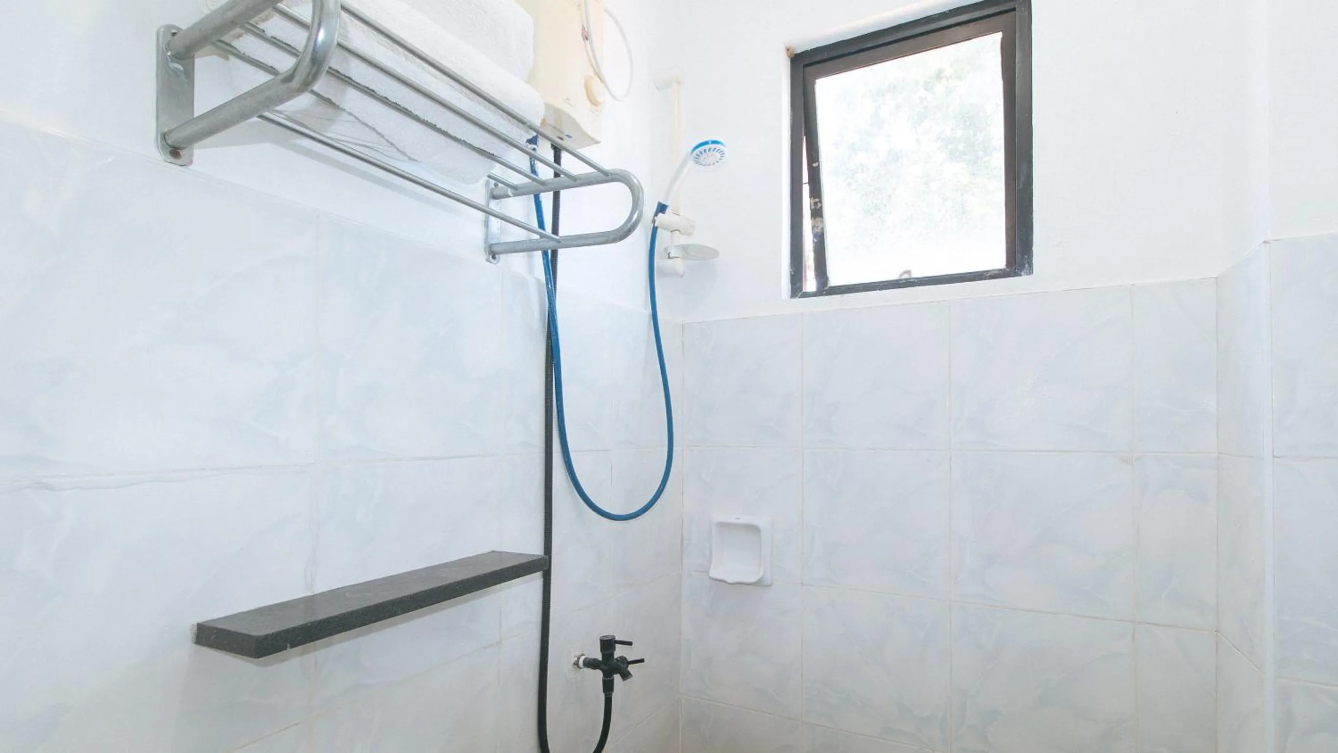 Shower in RedDoorz at Coco Grove Tourist Inn