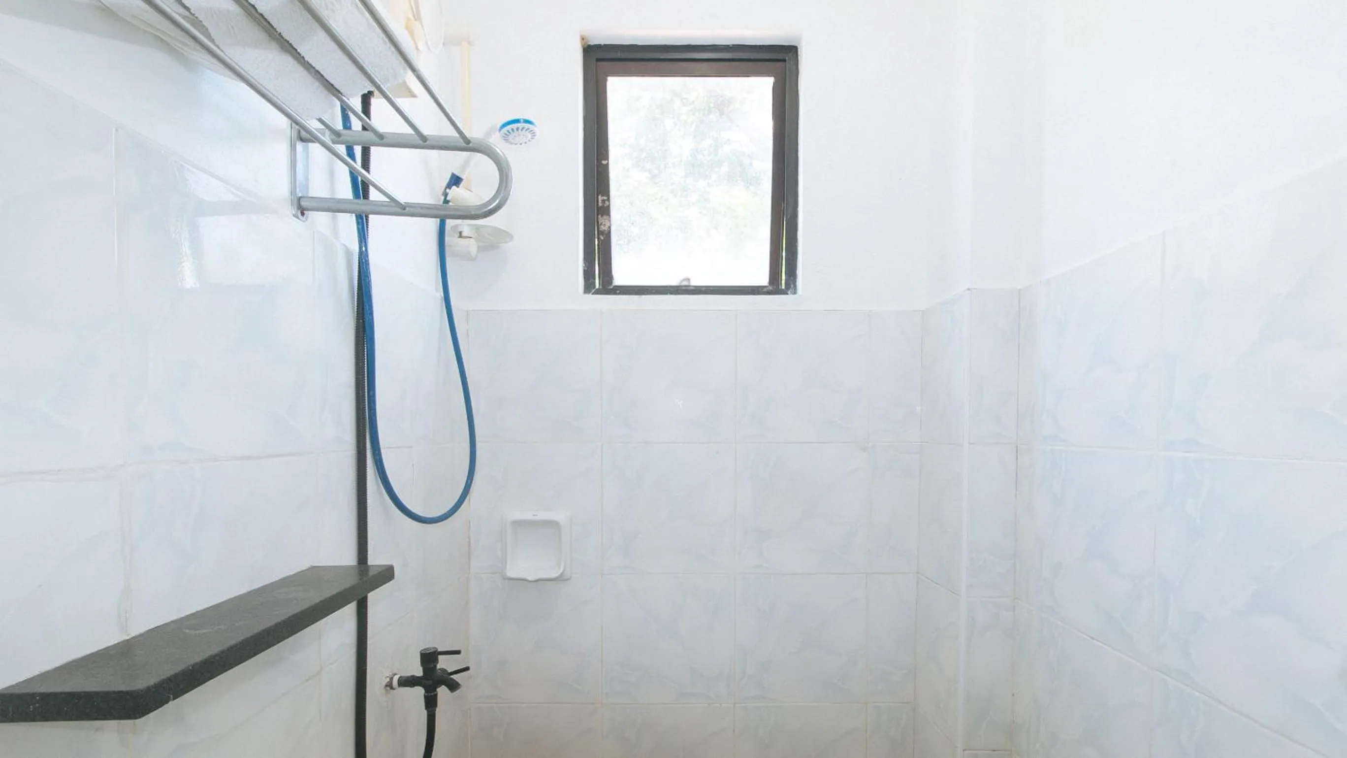 Shower in RedDoorz at Coco Grove Tourist Inn