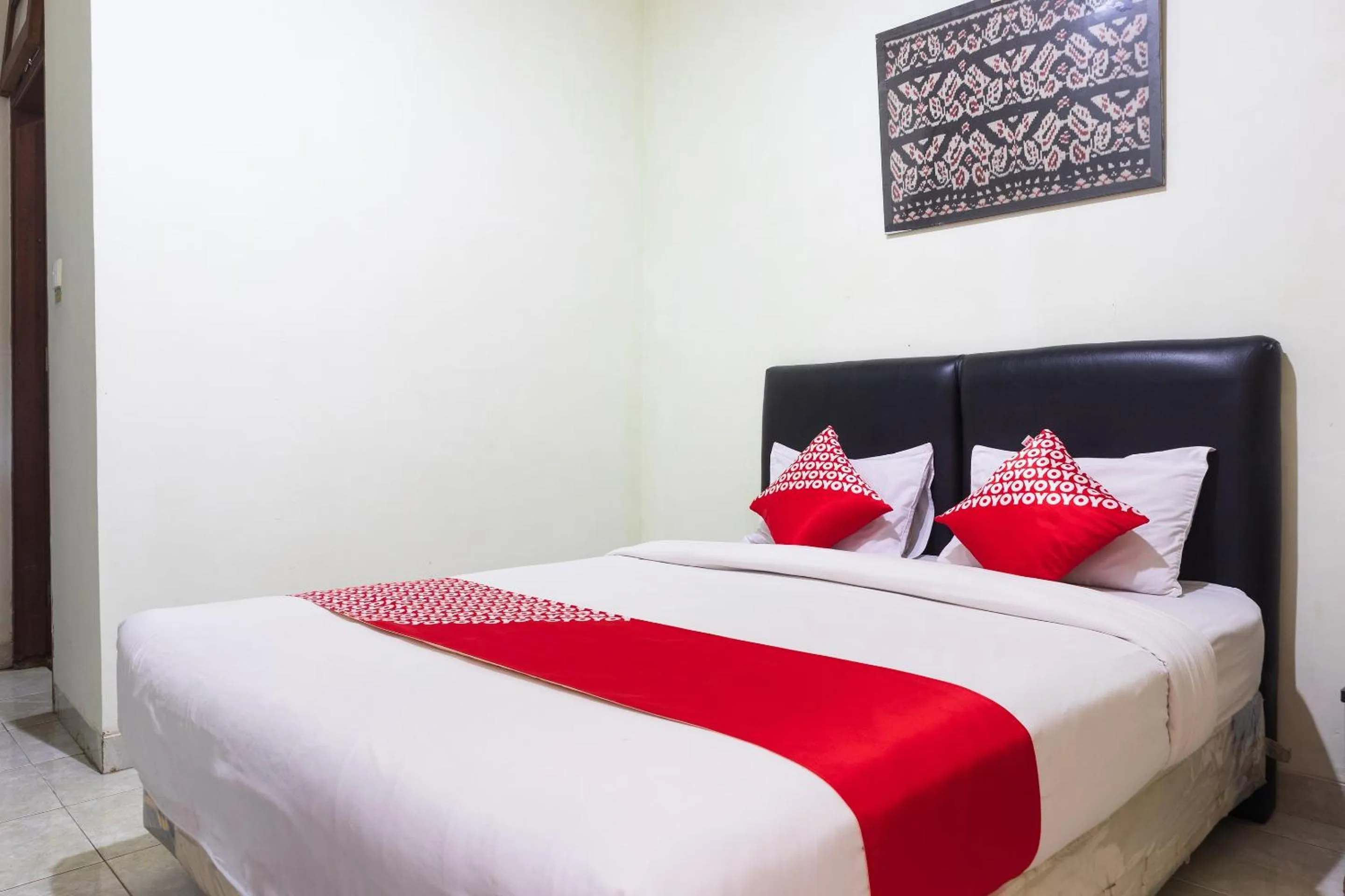 Bedroom in Super OYO 1682 Greenia Hotel