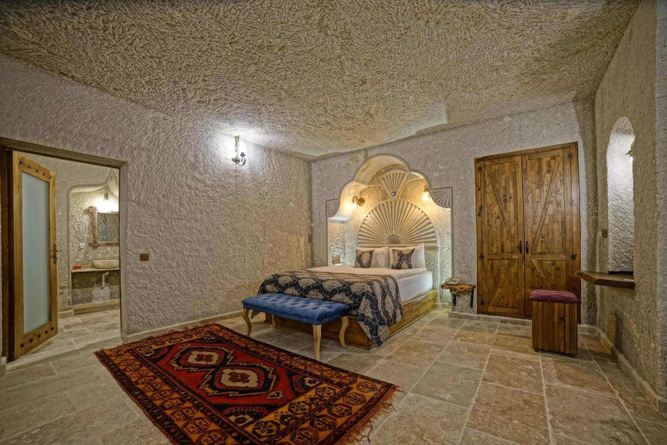 Bed in Risus Cave Suites