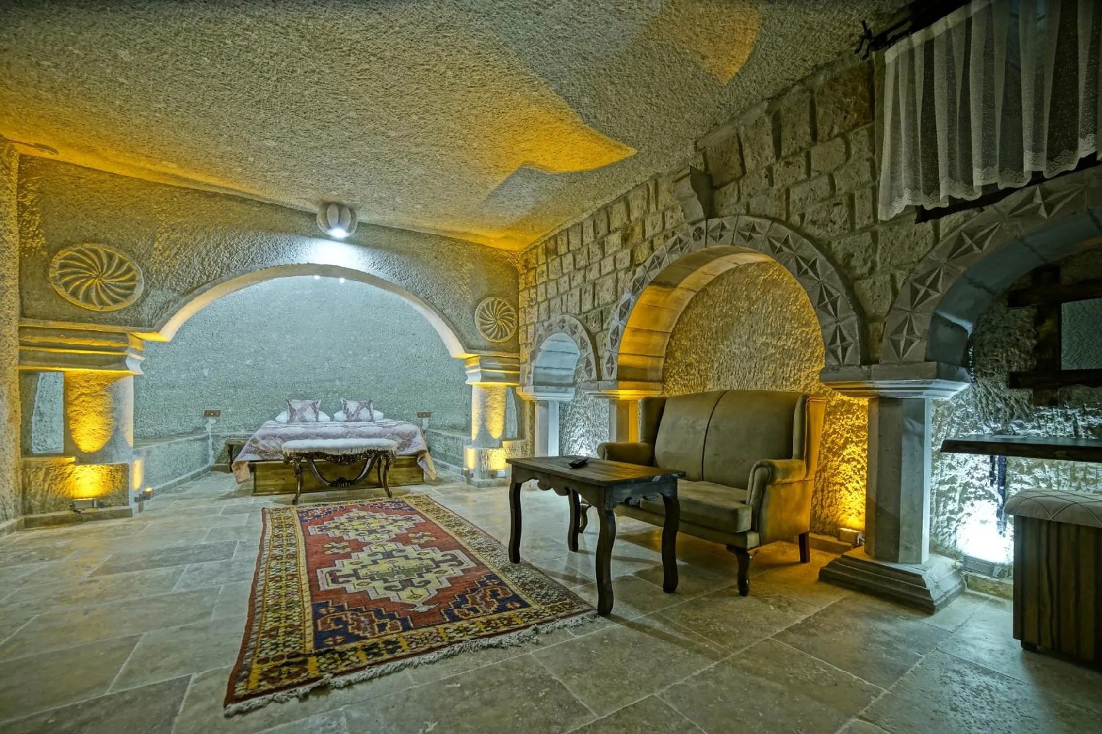 Bed in Risus Cave Suites