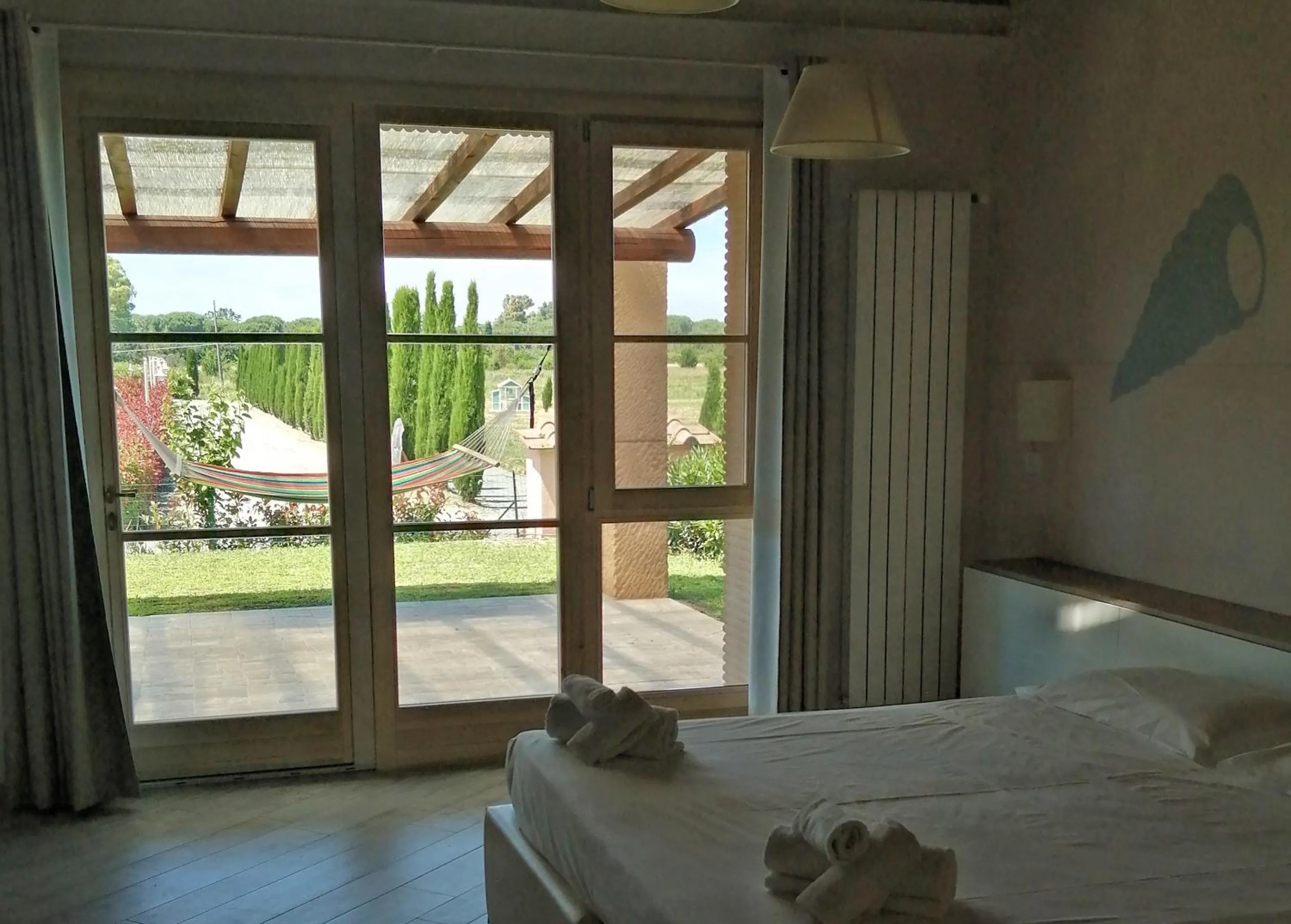 Patio, Bed in Fattoria Palazzeta - Pet & Family Friendly