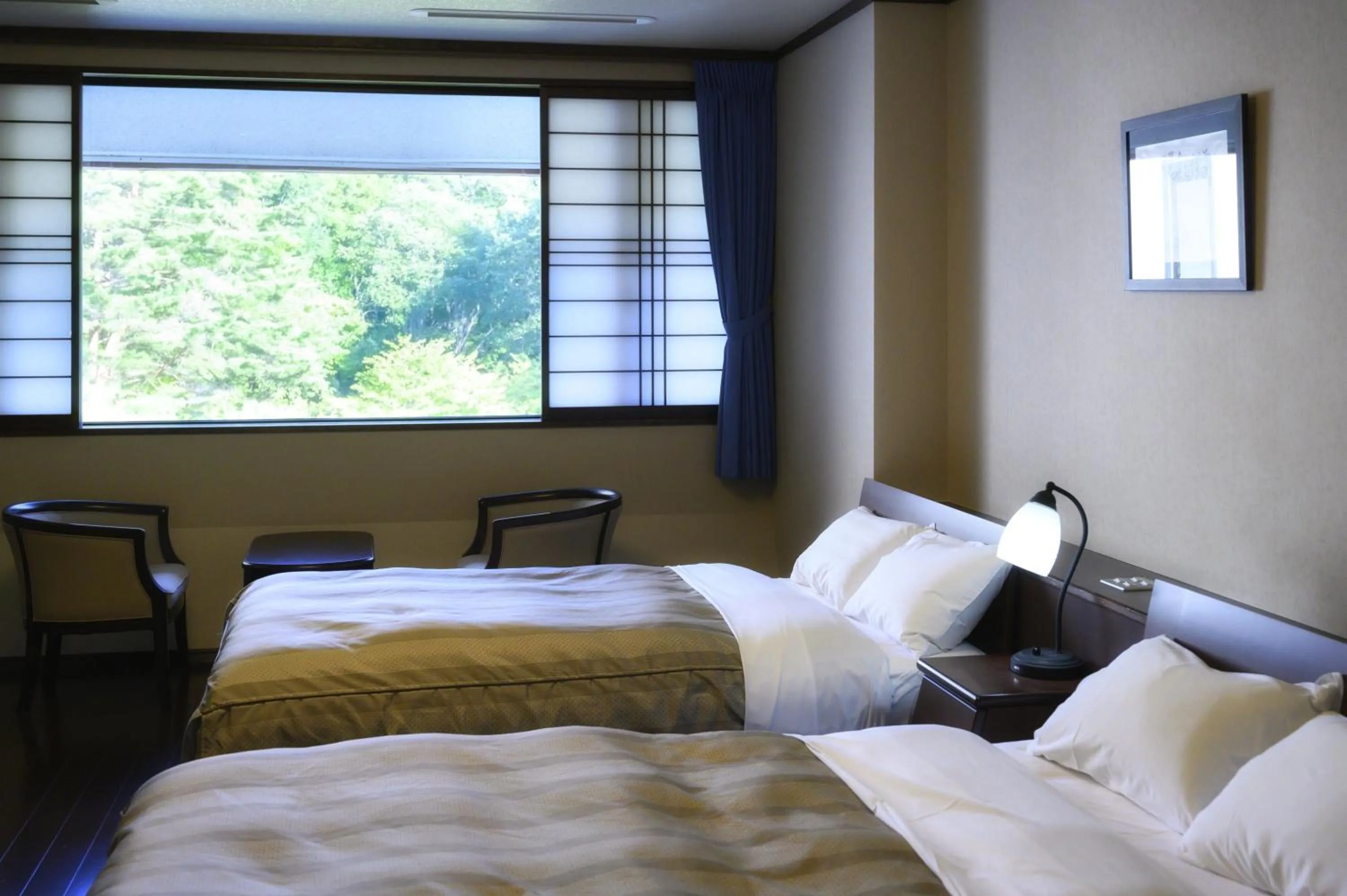 Bed in Takamiya Hotel Bonari no Mori