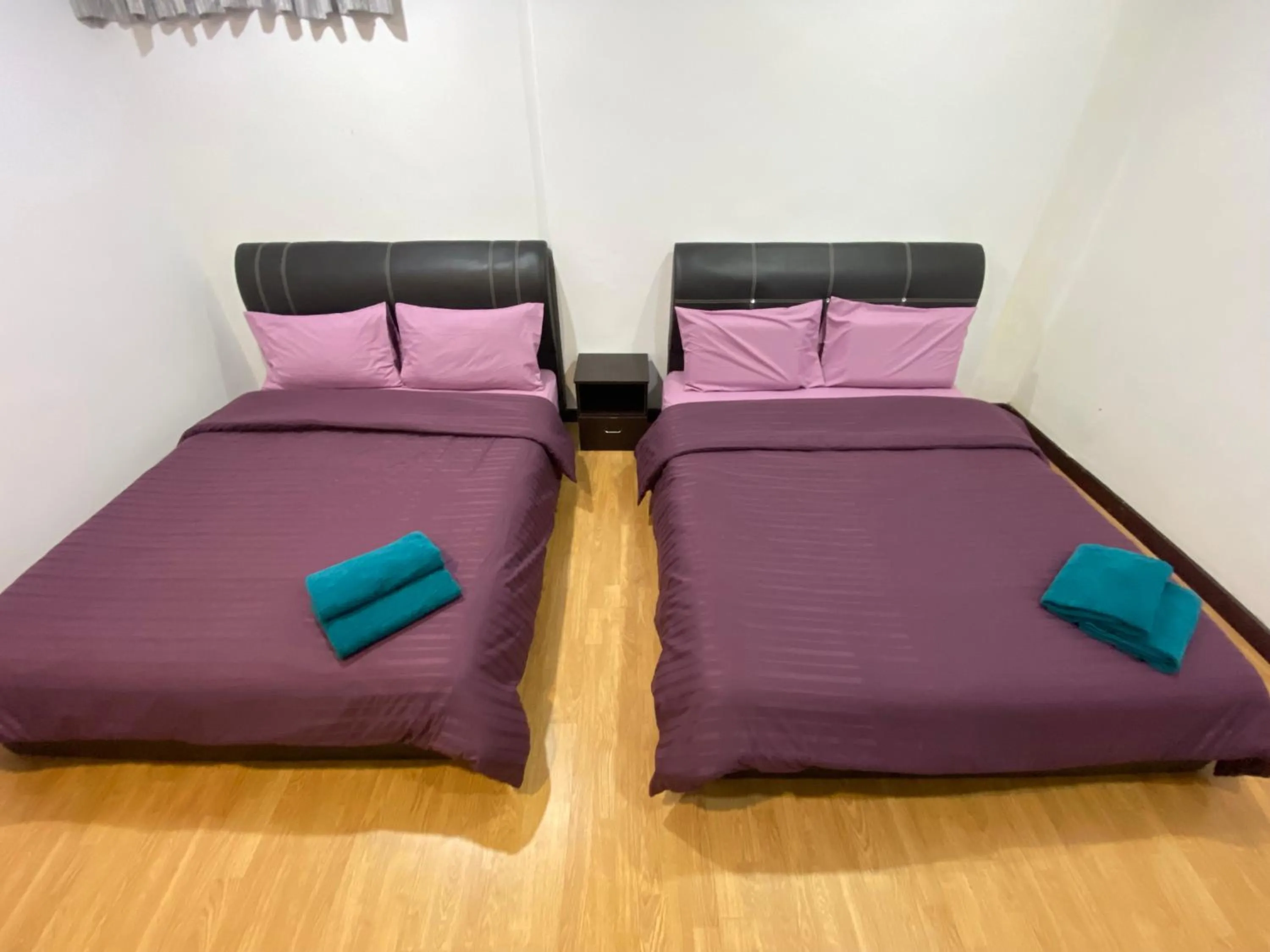 Bed in Imperial Suites at Boulevard Mall