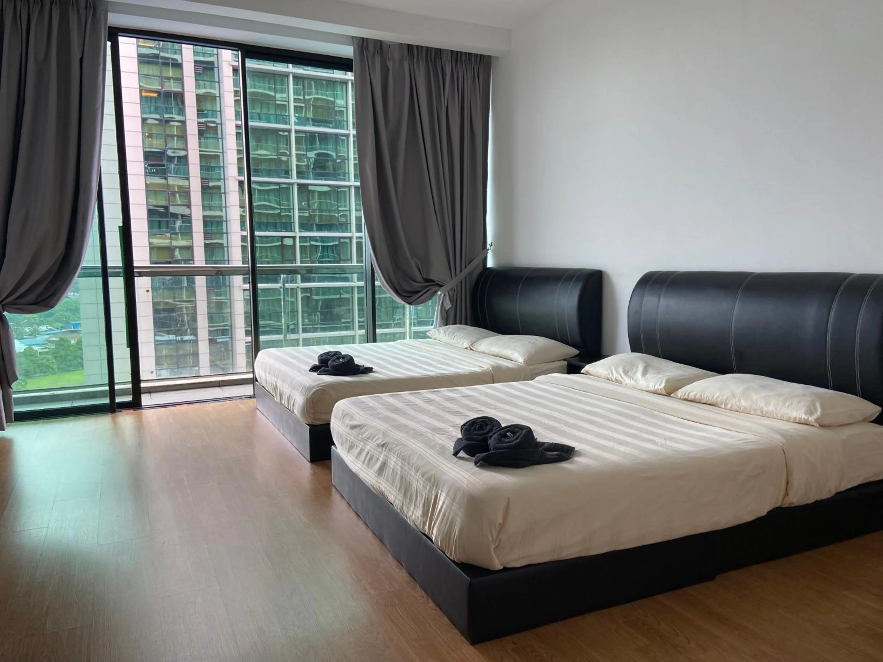 Bed in Imperial Suites at Boulevard Mall