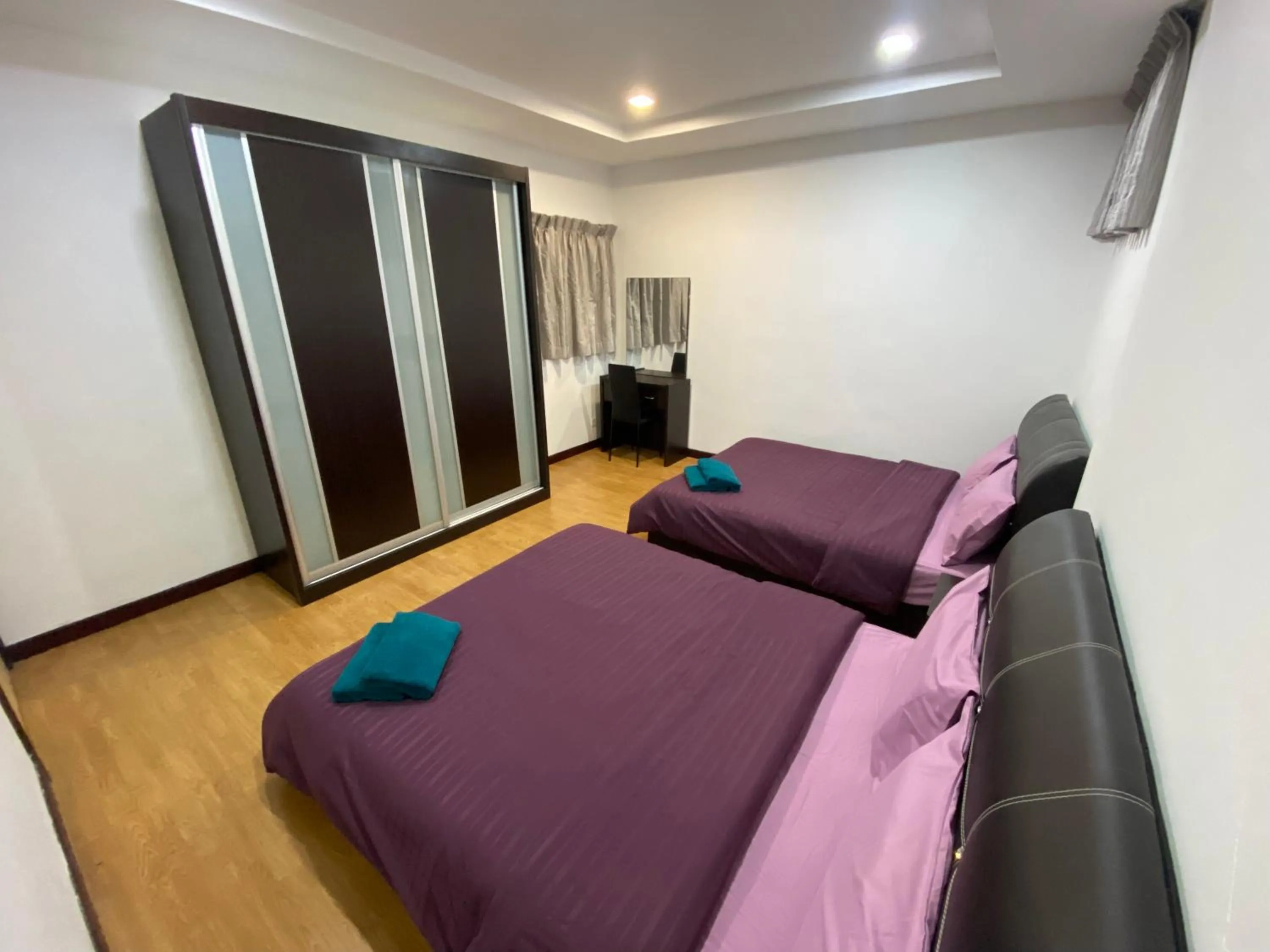 Bed in Imperial Suites at Boulevard Mall