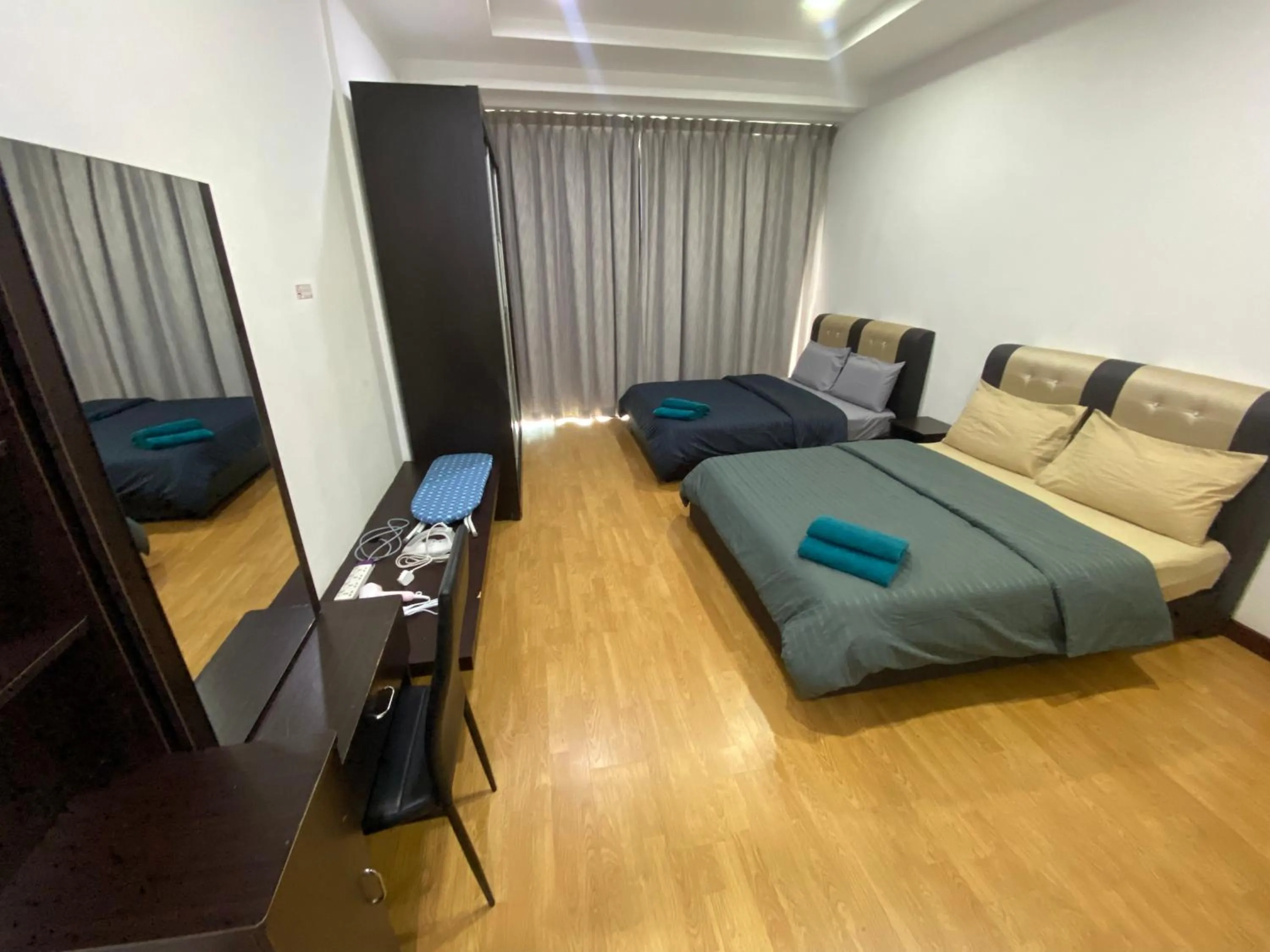 Bed in Imperial Suites at Boulevard Mall