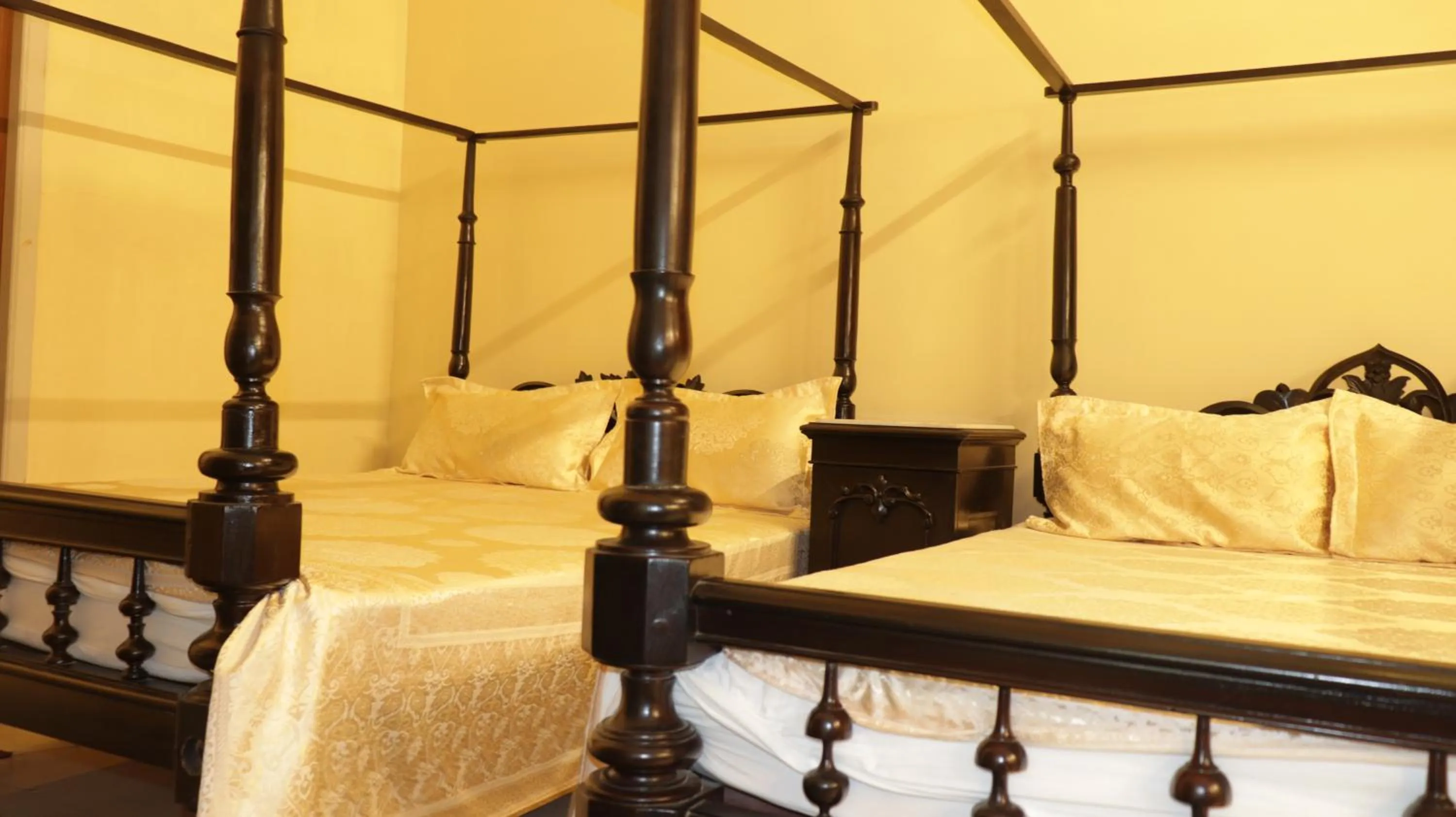 Bed in COSSIMBAZAR PALACE OF THE ROYS ( RAJBARI)