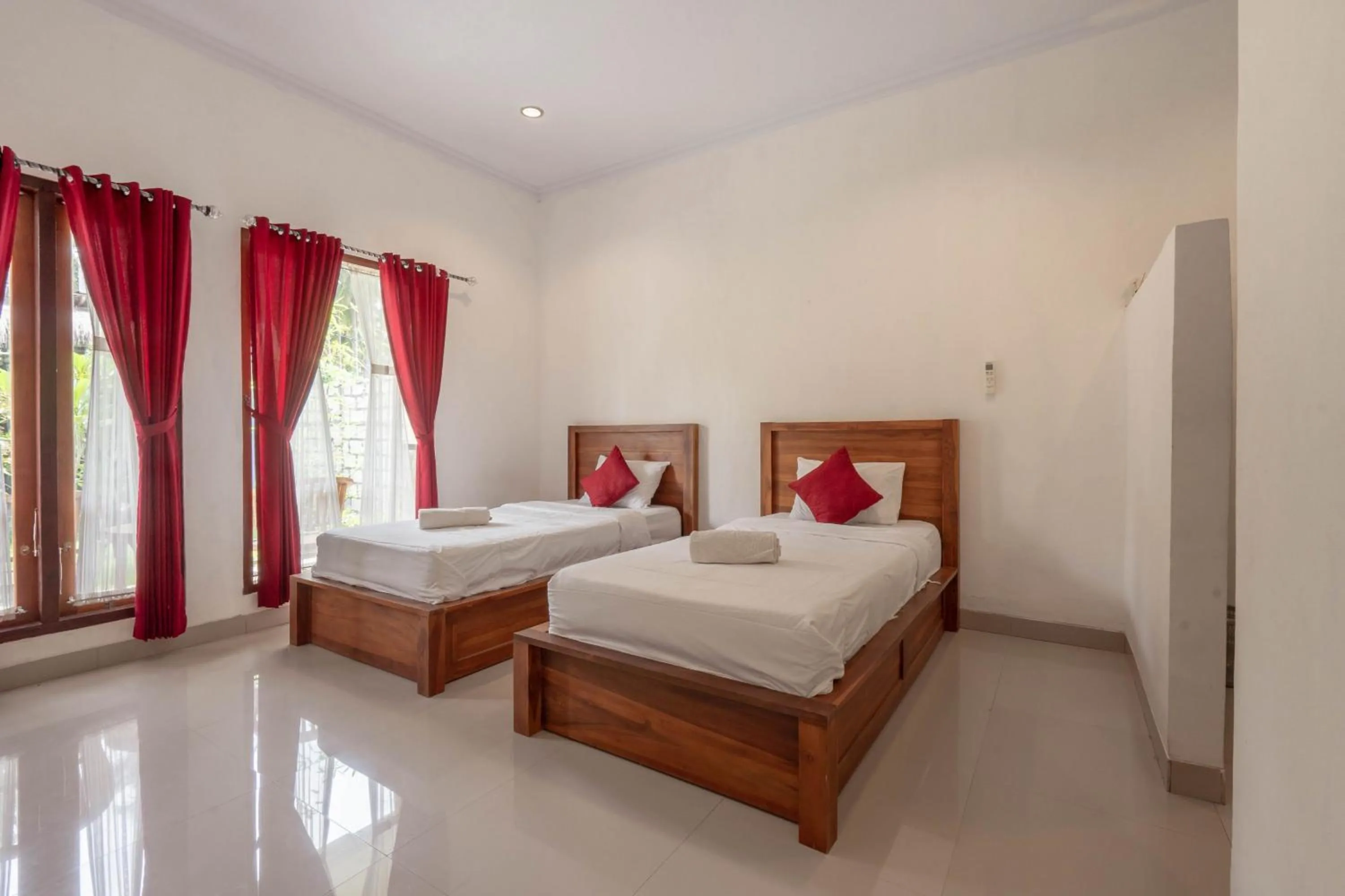 Bed in Omah Nusa Guesthouse RedPartner