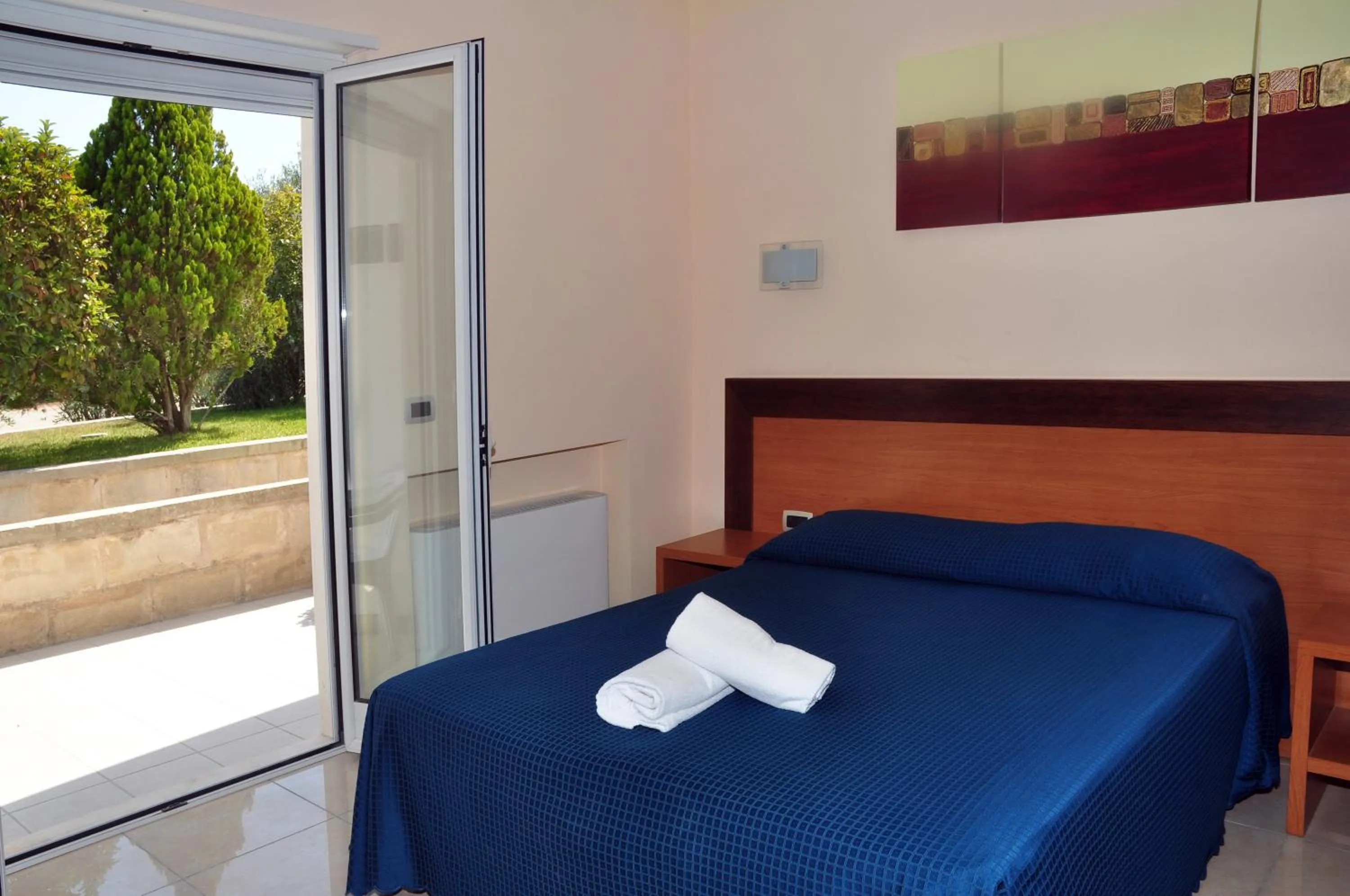 Bedroom in Hotel Club Koiné