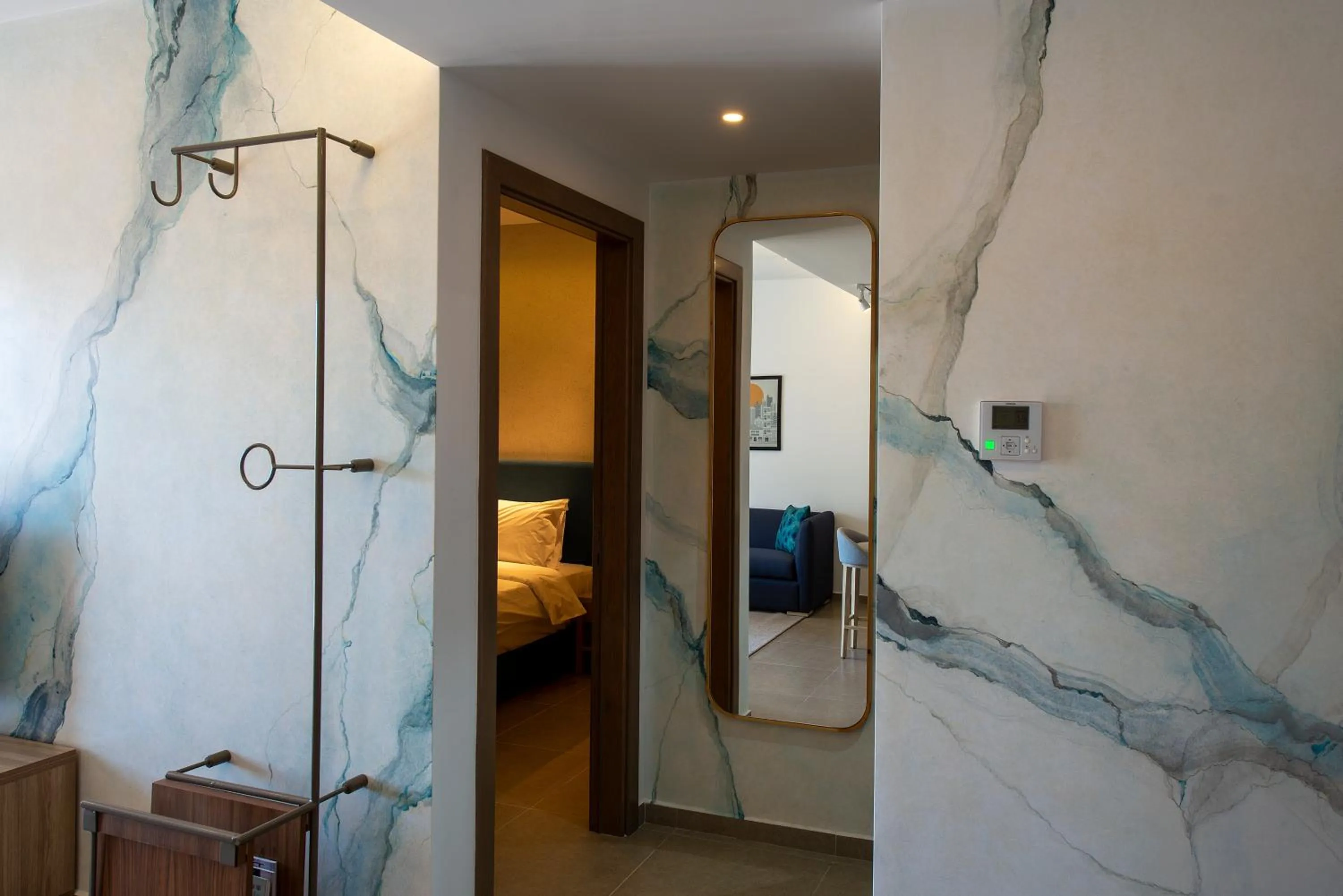 Living room, Bed in ZUR Studios and Suites