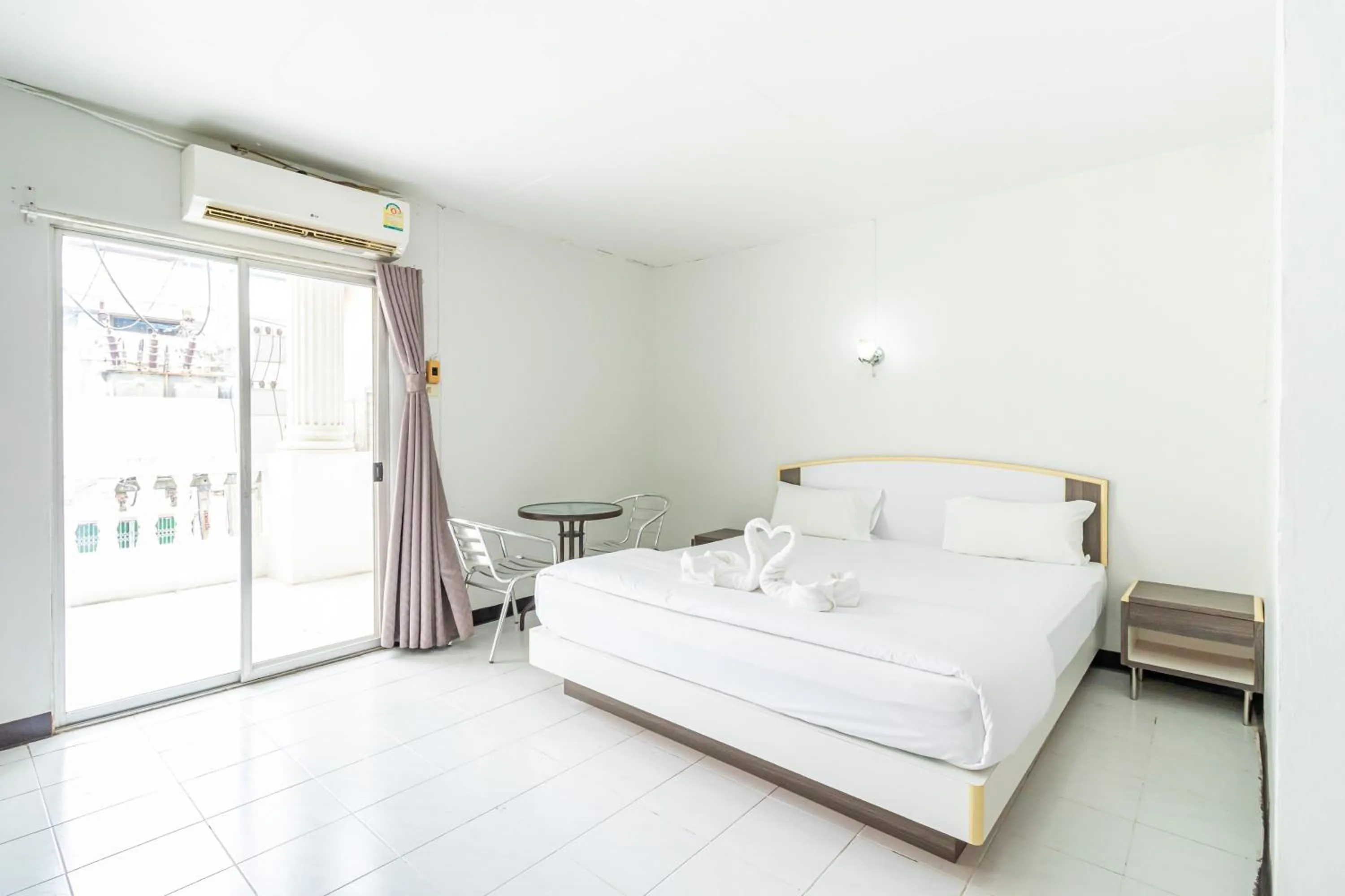 Bed in Boonchai Mansion