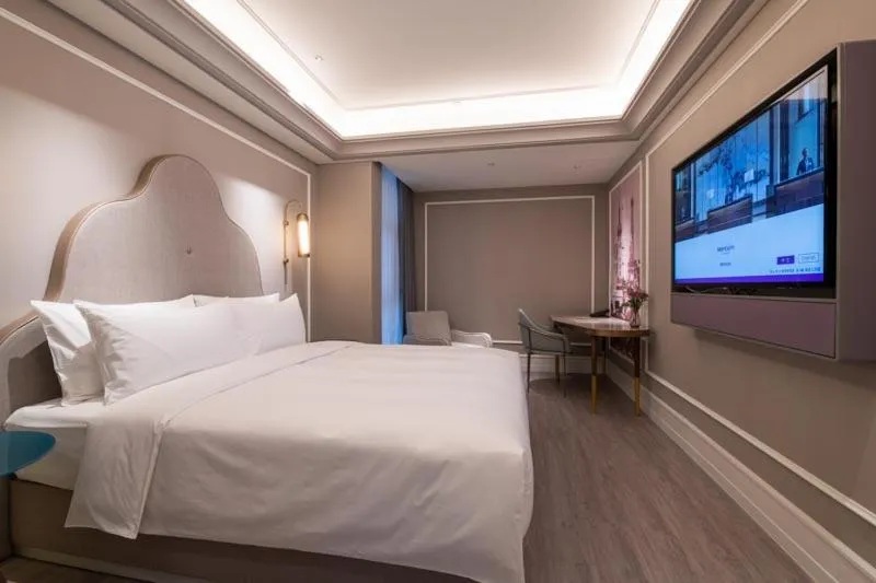 Bed in Mercure Shanghai Guangda Convention and Exhibition Center