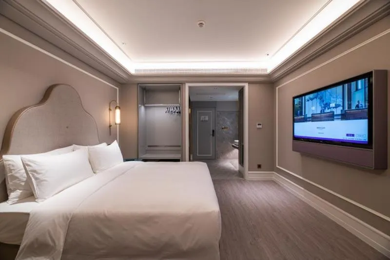 Bed in Mercure Shanghai Guangda Convention and Exhibition Center
