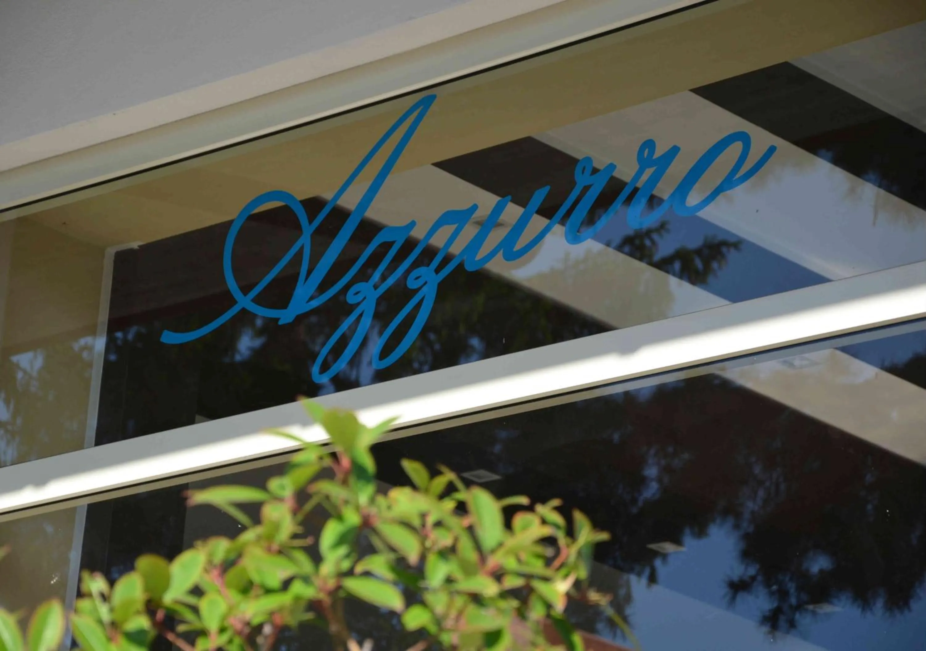 Property logo or sign in Hotel Azzurro