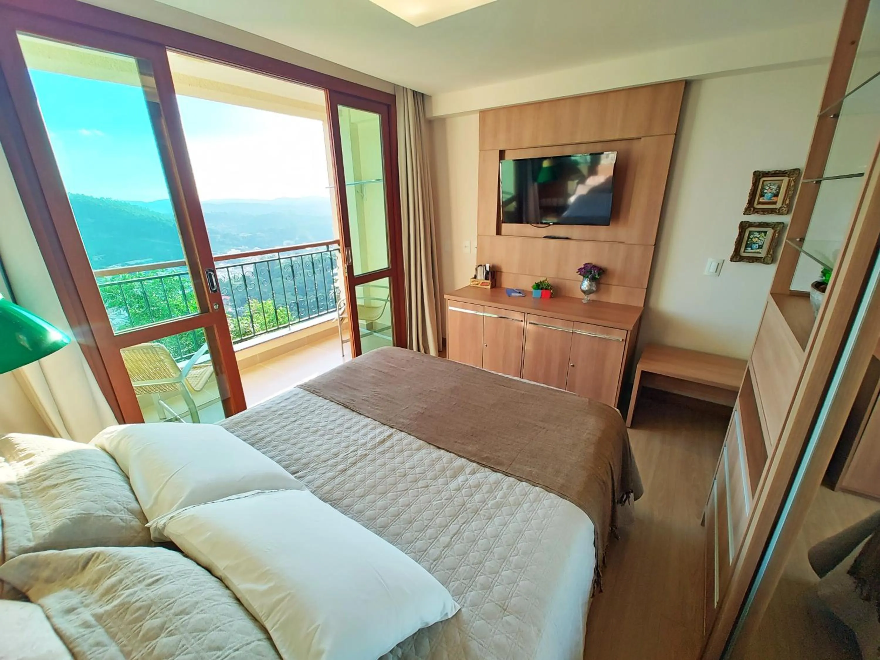 Bed in FLAT VARANDA PEDRA AZUL - Vista Azul Apart Hotel