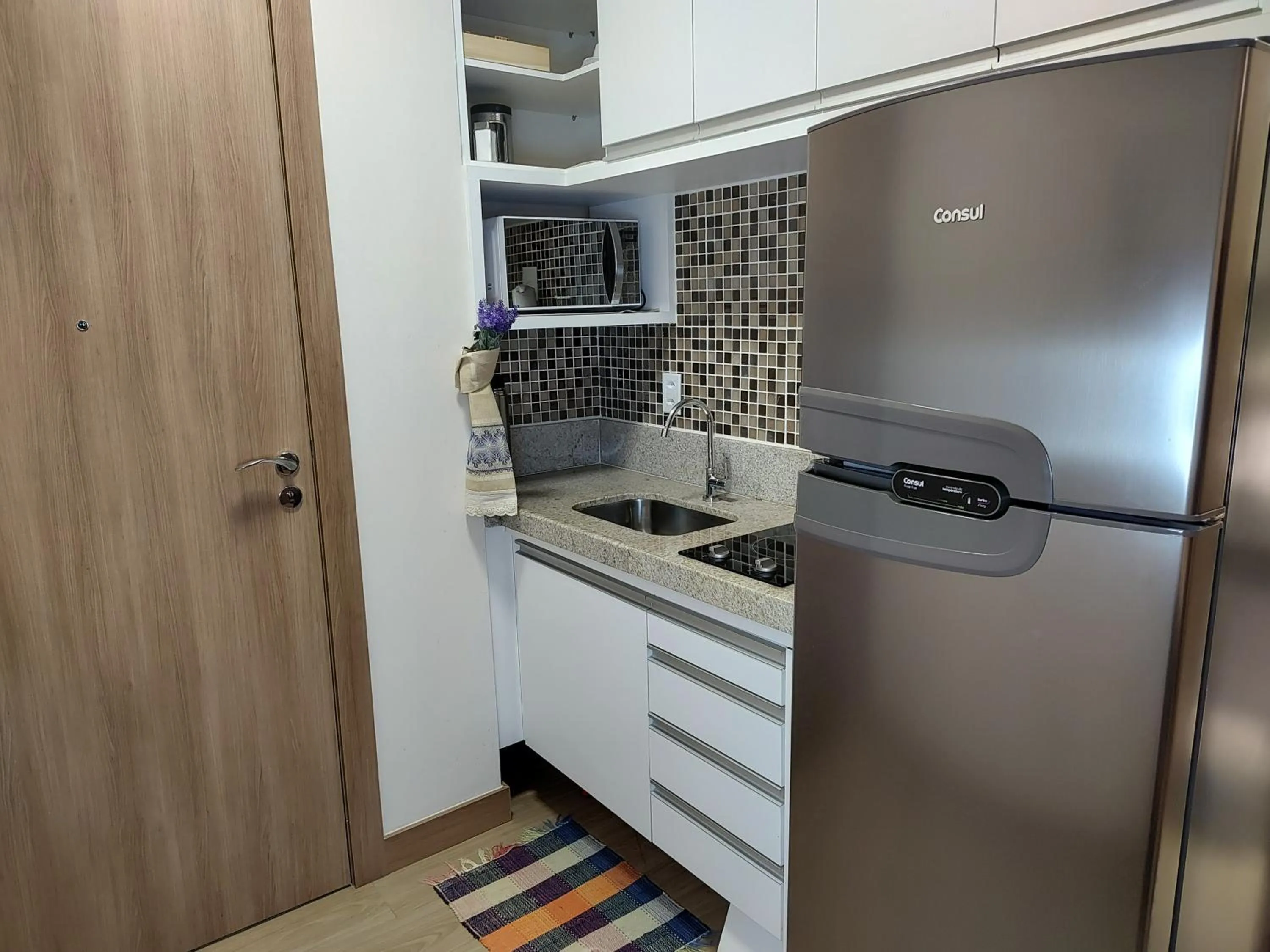 Kitchen or kitchenette in FLAT VARANDA PEDRA AZUL - Vista Azul Apart Hotel