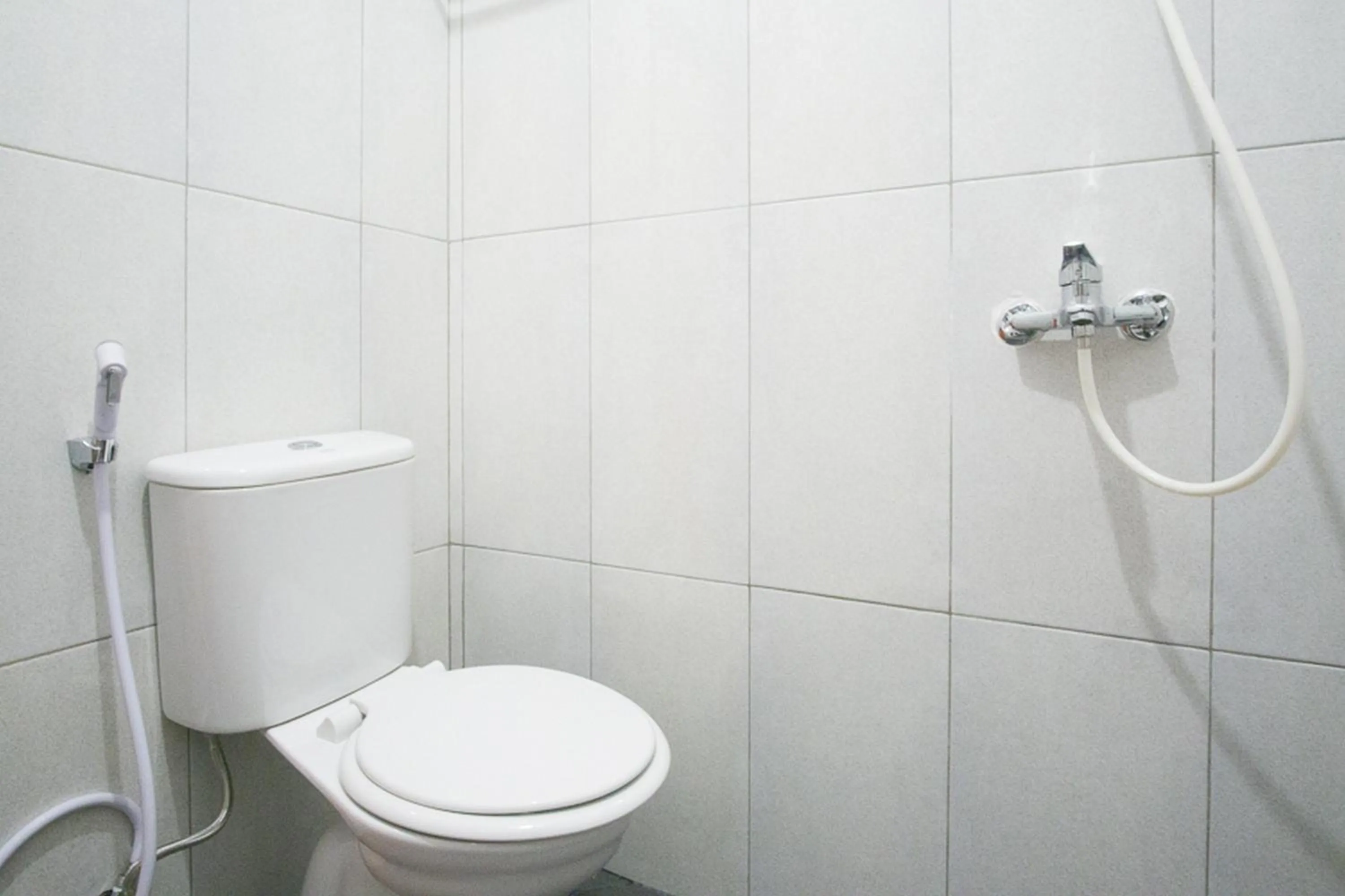 Bathroom in RedDoorz @ RS Adam Malik Medan