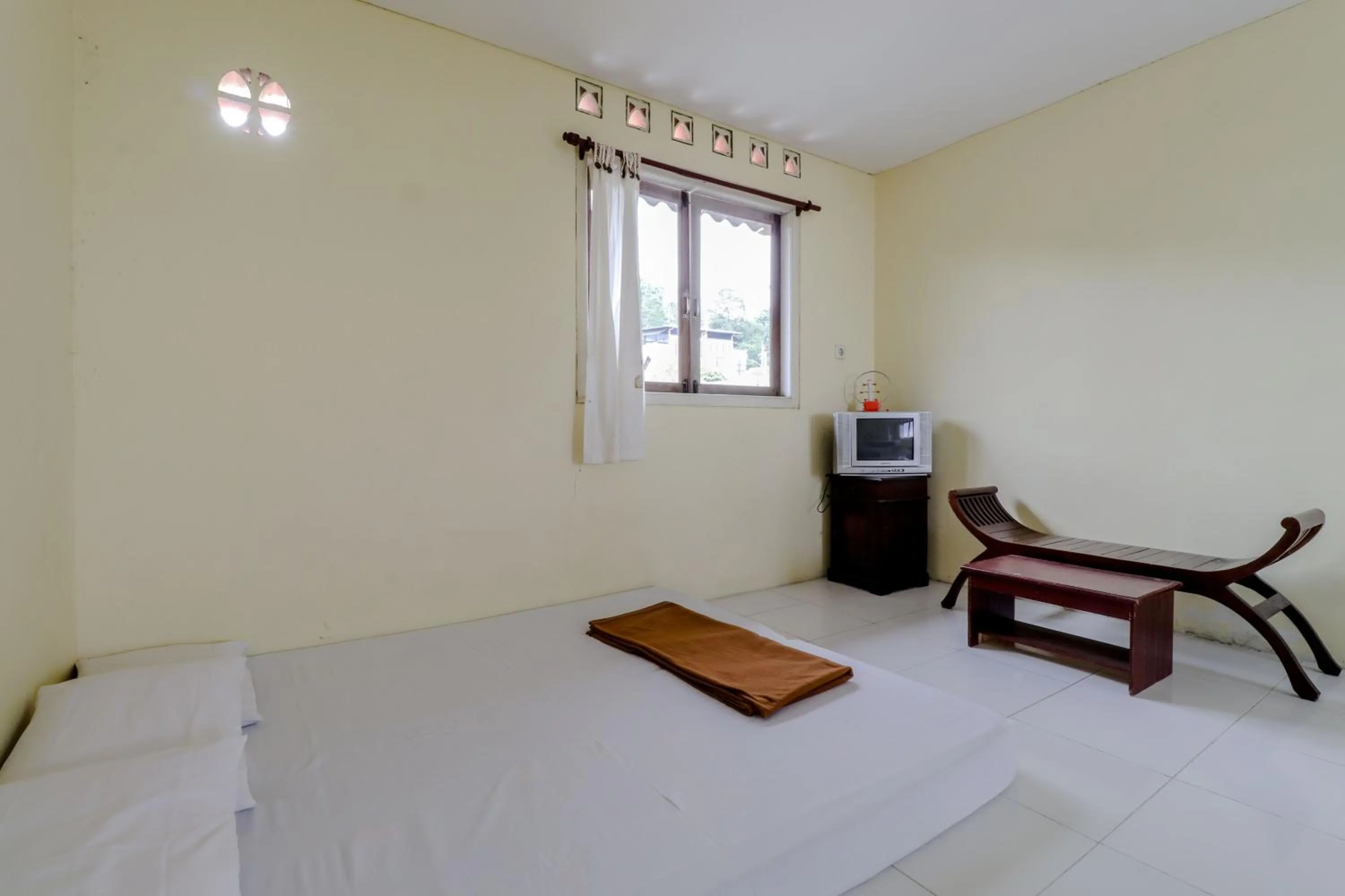 Bed in Hotel Kayu Manis