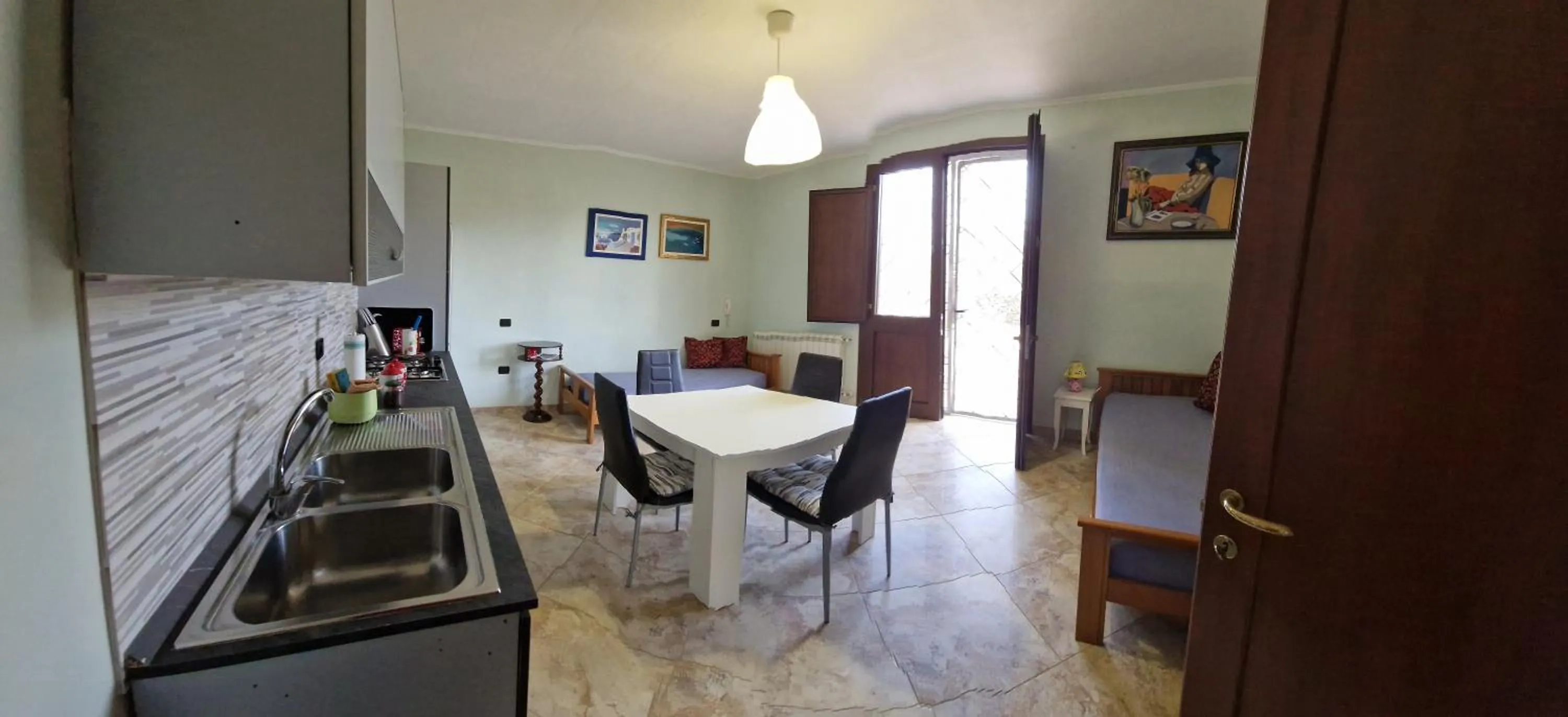 Kitchen or kitchenette in Portoselvaggio Villa Martina