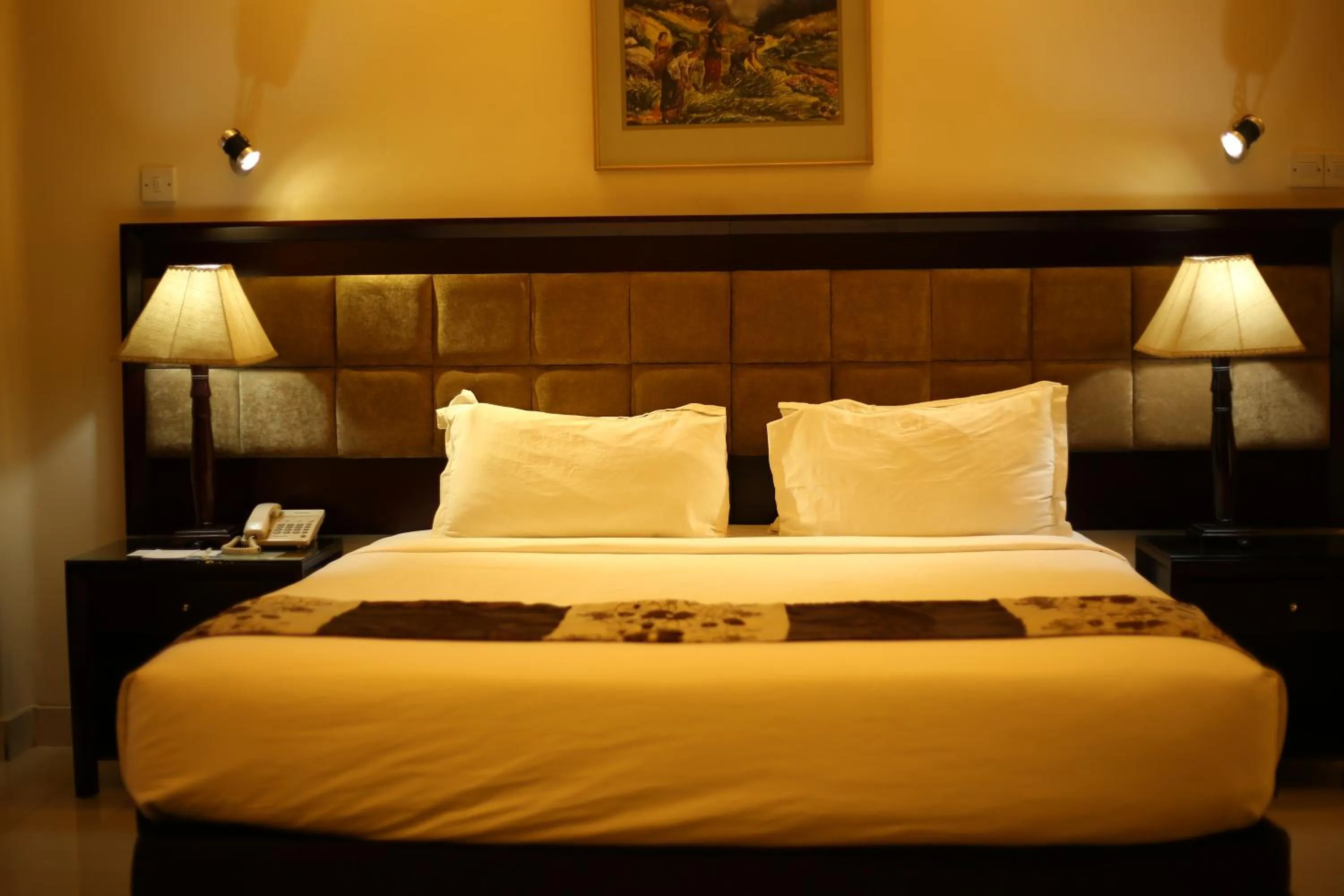 Bed in The Avenue Hotel & Suites