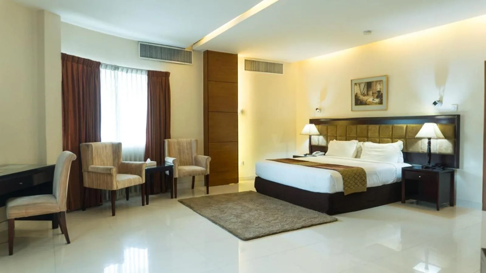 Bed in The Avenue Hotel & Suites