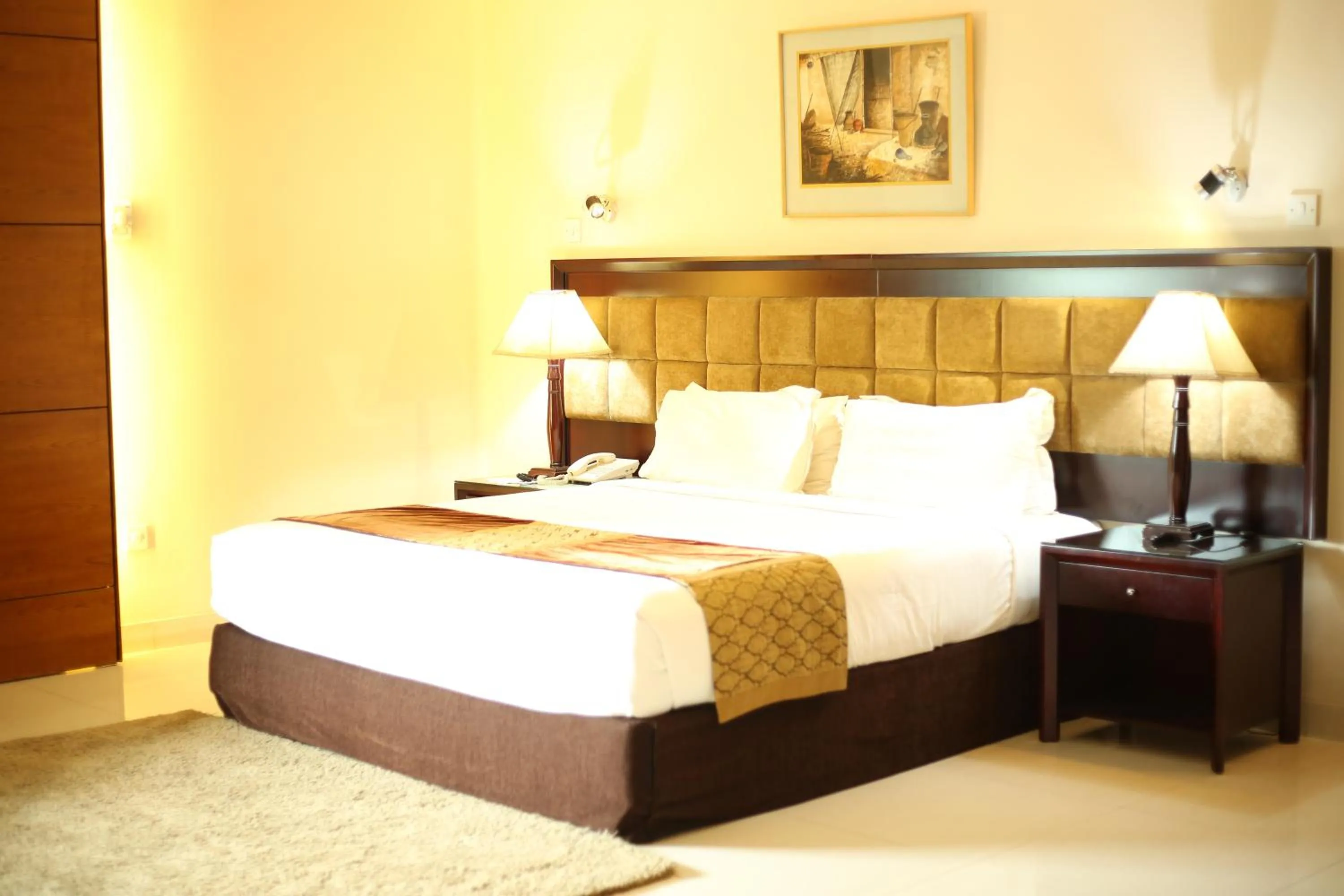 Bed in The Avenue Hotel & Suites