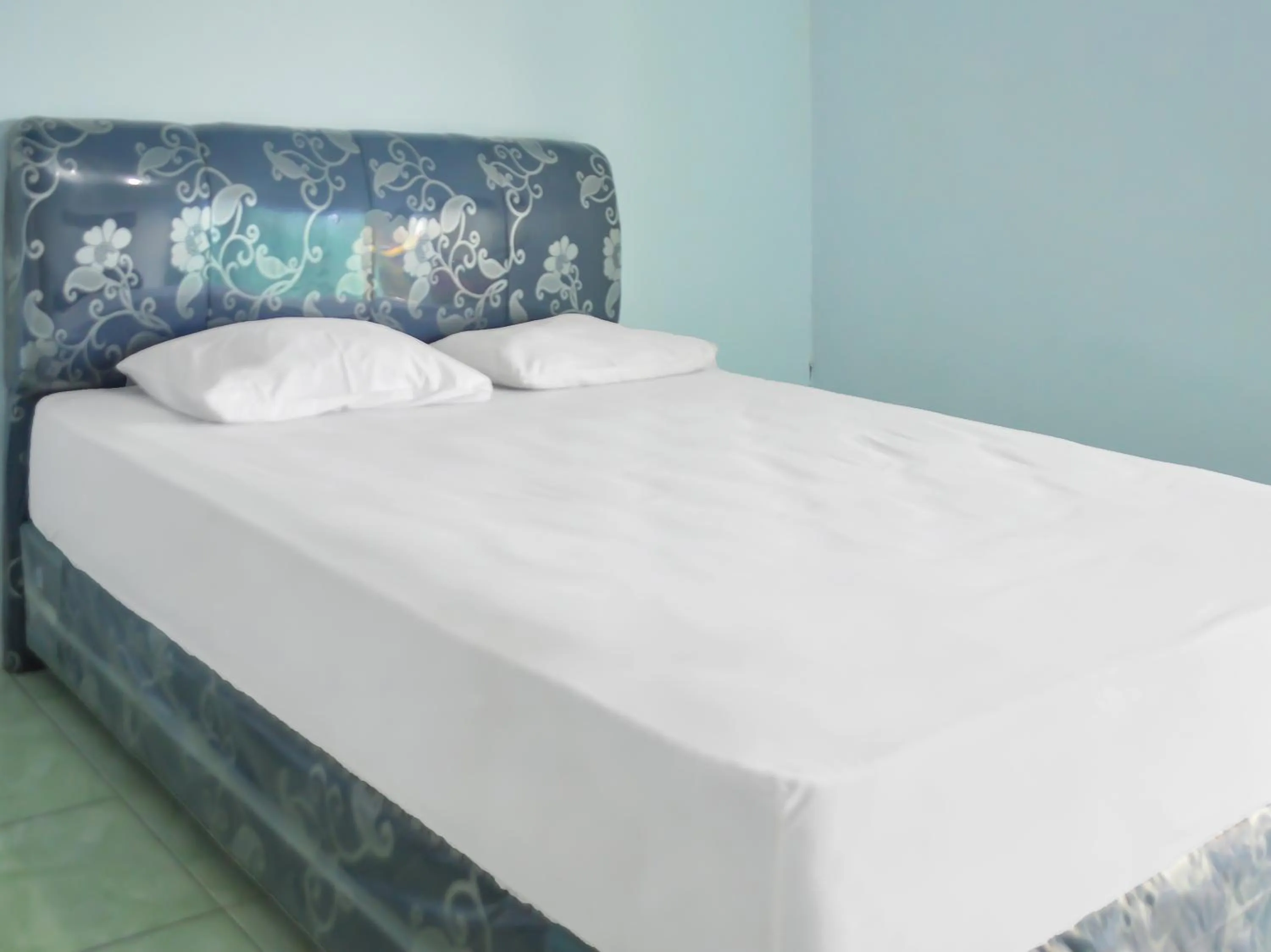 Bedroom in OYO 1745 Guest House Nur Aziziah Syariah 2