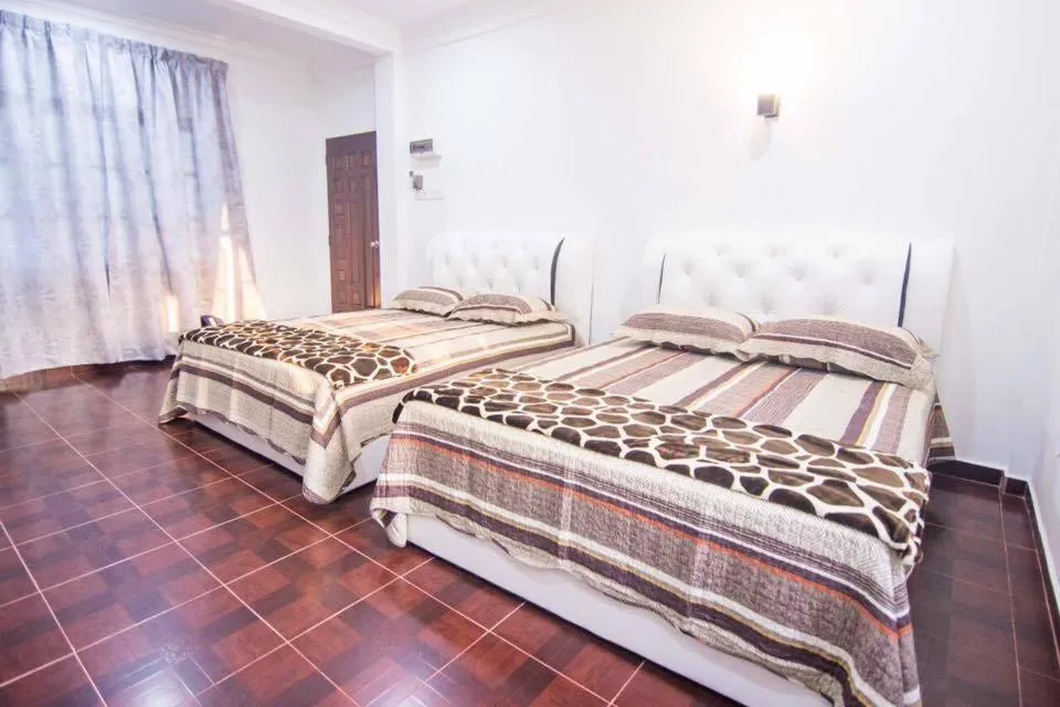 Bed in Wan Danisha Villa Inn