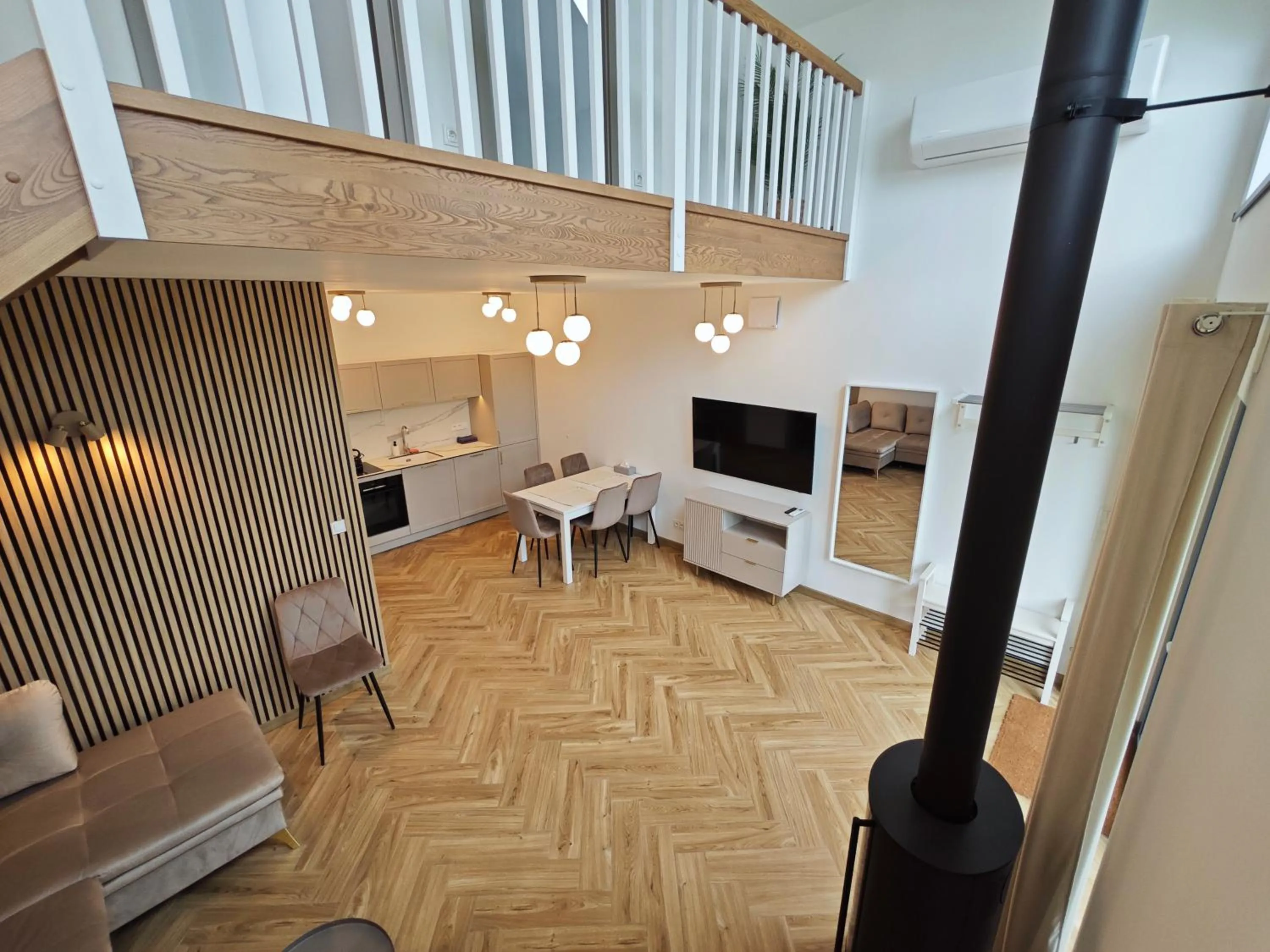 Communal lounge/ TV room in Apartamenty Zielona Lipka