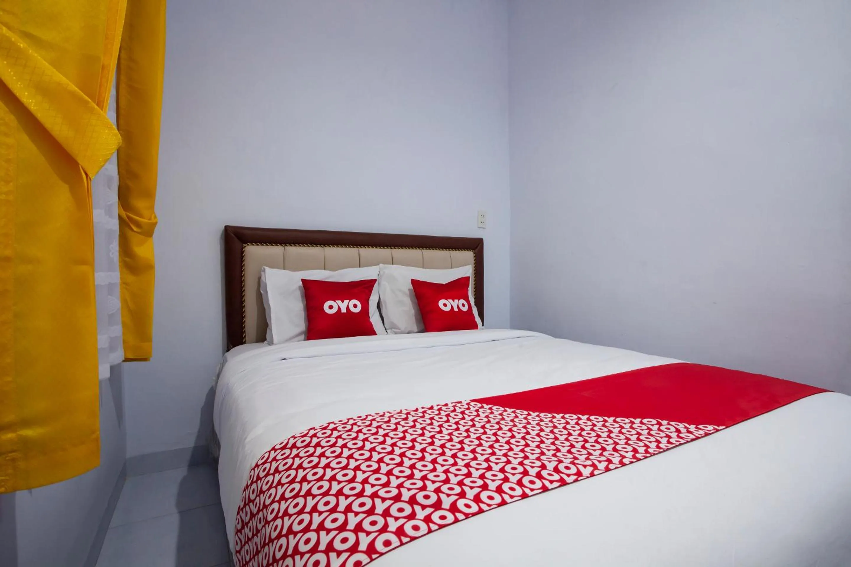 Bedroom in OYO 1764 Sopou Penginapan Rinal & Tuah