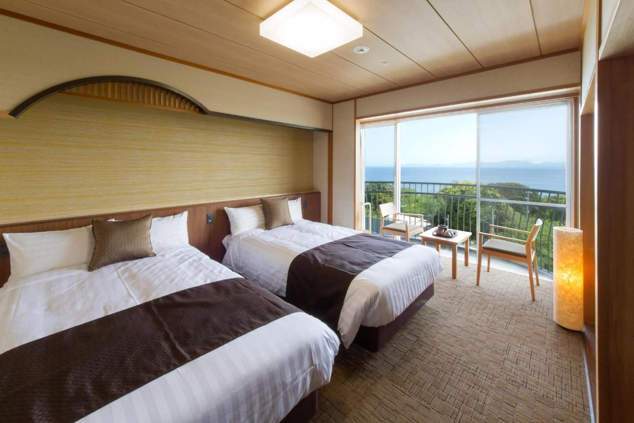 Bed in KAMENOI HOTEL Genkainada